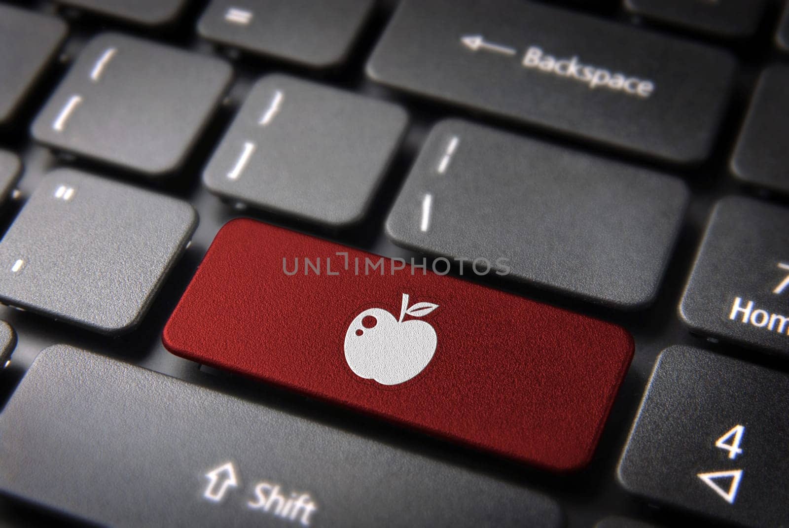 Love key with apple icon on laptop keyboard. Included clipping path, so you can easily edit it.