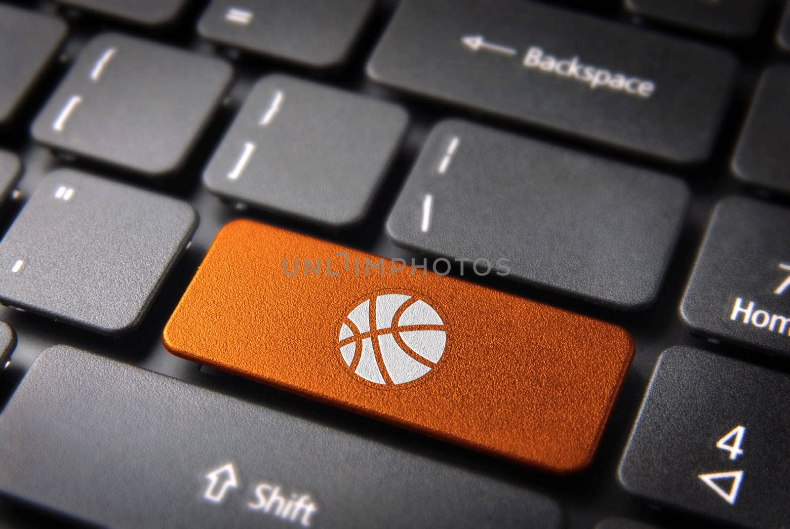 Sports key with basket ball icon on laptop keyboard. Included clipping path, so you can easily edit it.
