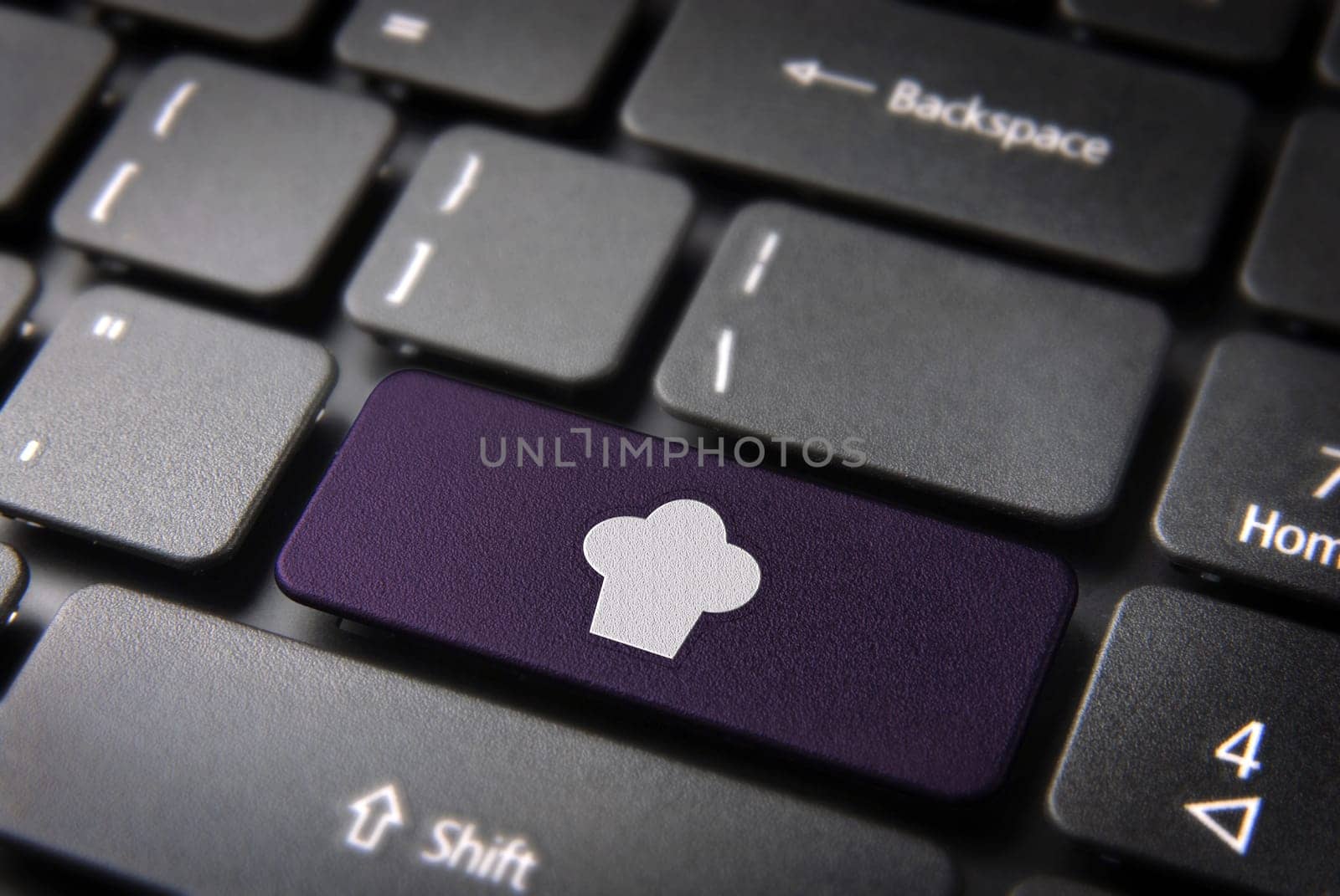 Gourmet key with Chef hat icon on laptop keyboard. Included clipping path, so you can easily edit it.