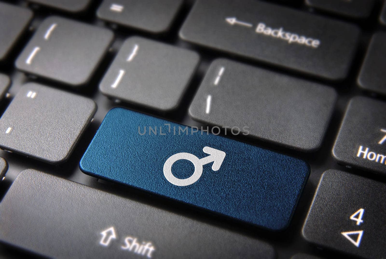 Gender key with Male icon on laptop keyboard. Included clipping path, so you can easily edit it.