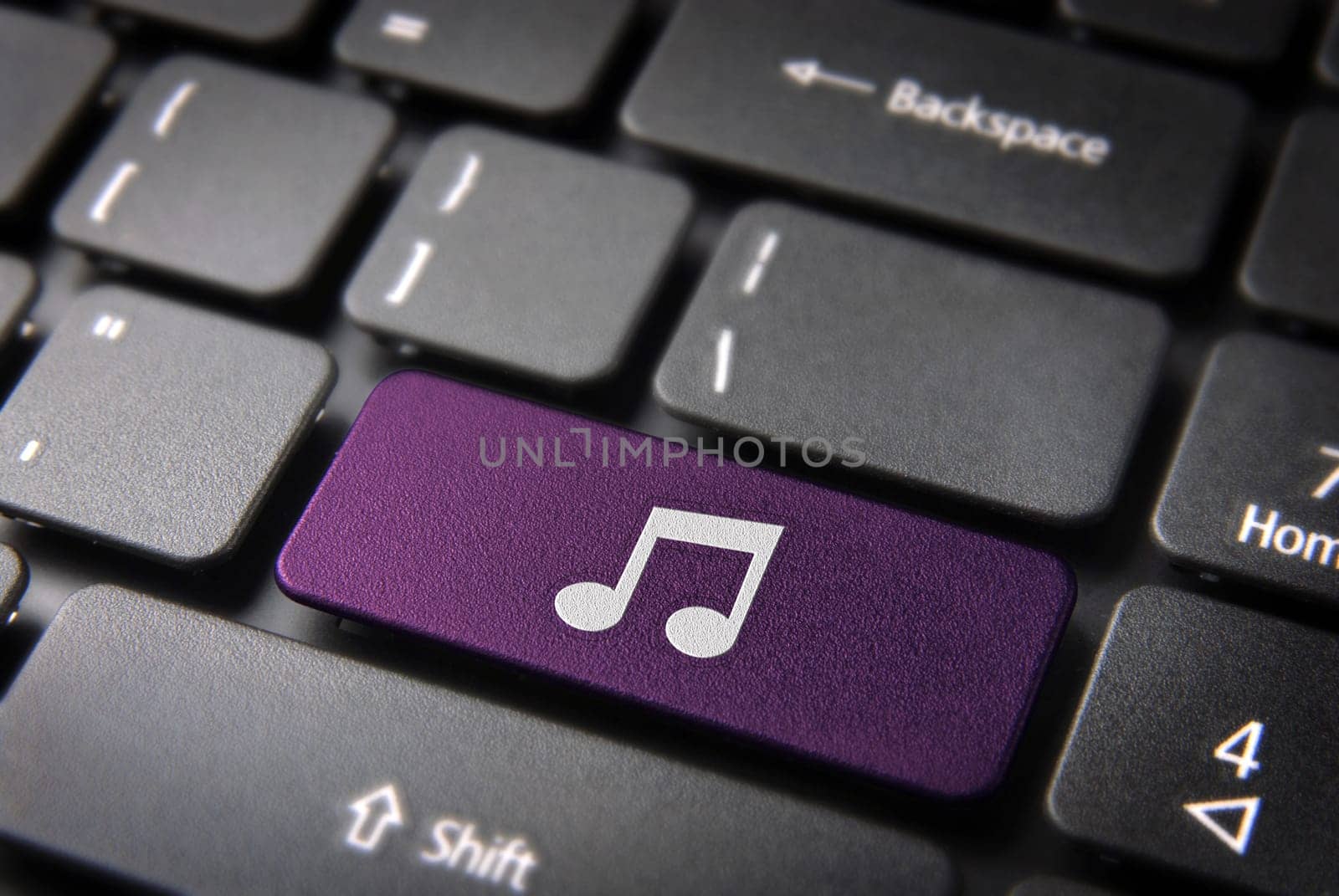 Entertainment key with Music note icon on laptop keyboard. Included clipping path, so you can easily edit it.