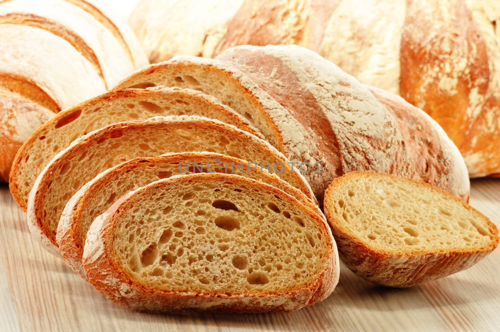 Composition with loafs of bread isolated on white background