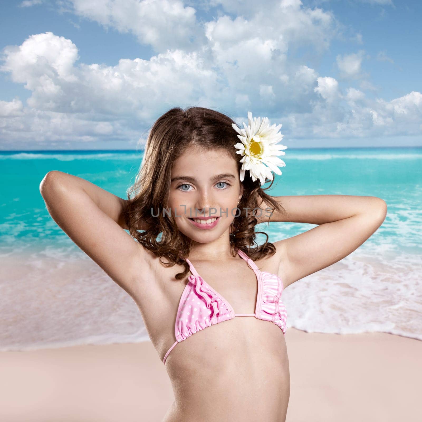 Brunette girl in tropical beach with daisy flower happy for vacation vintage color