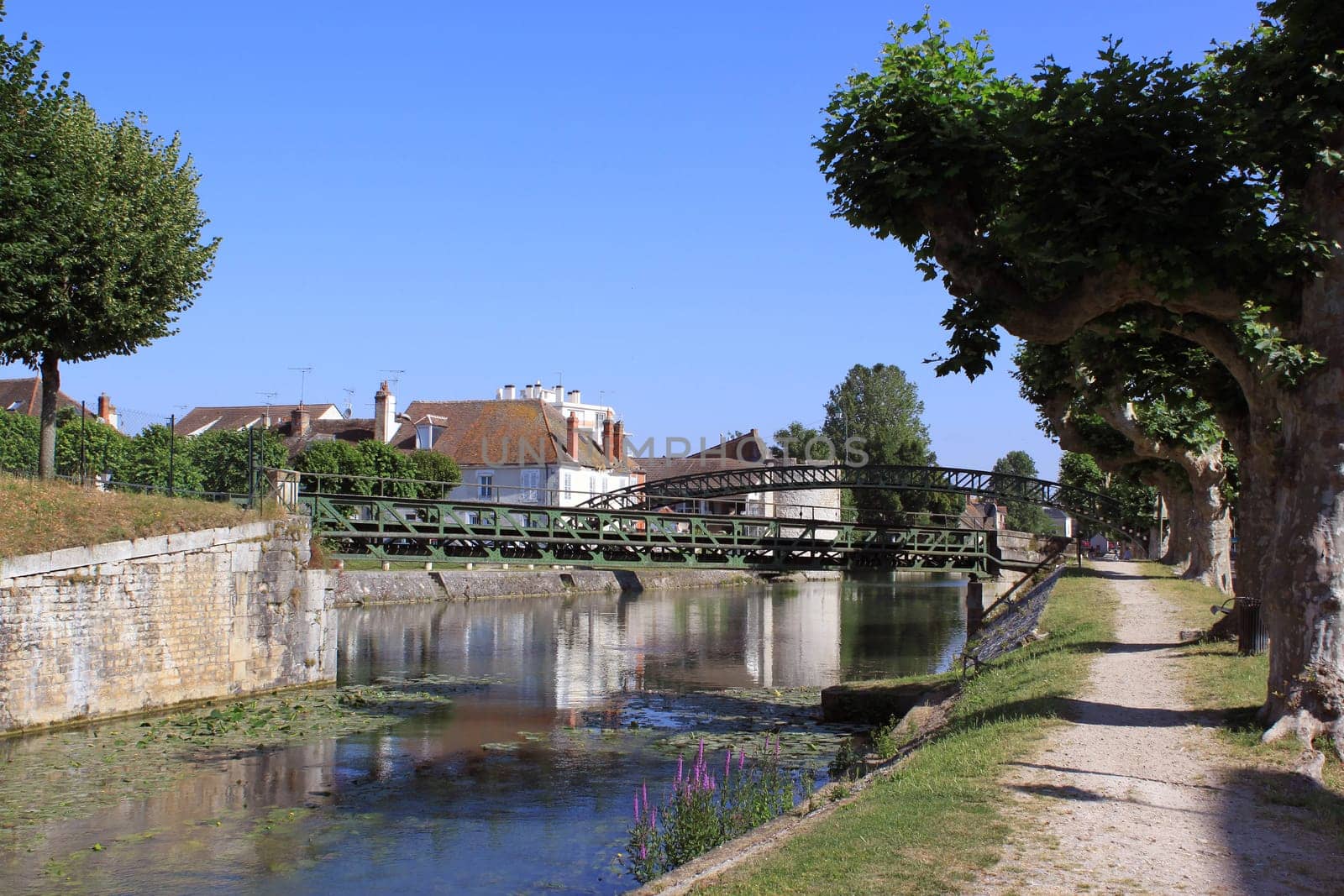a river flowing into the canal Briare to Montargis with its rainbow bridge rainbow