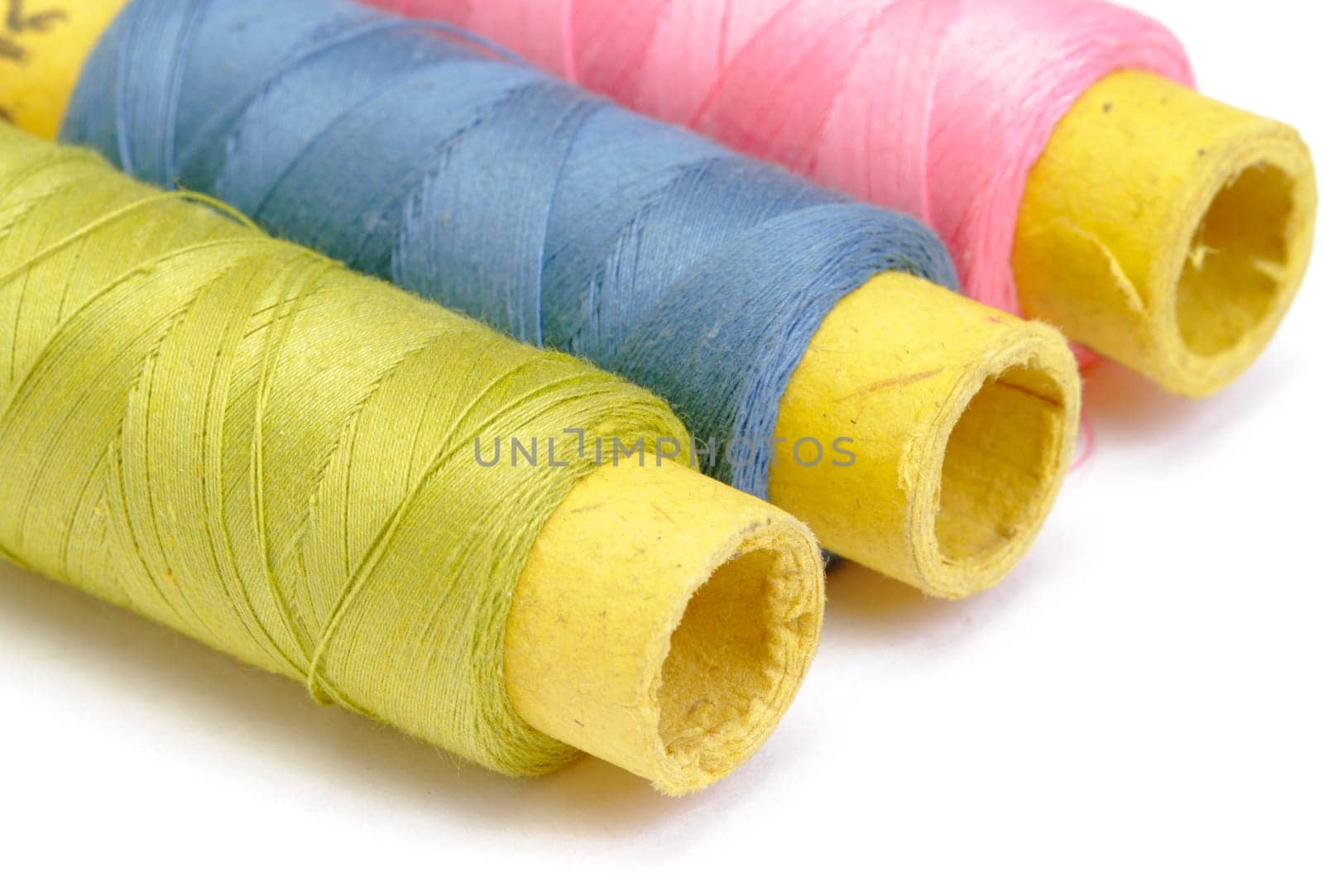 Spools of thread on white background
