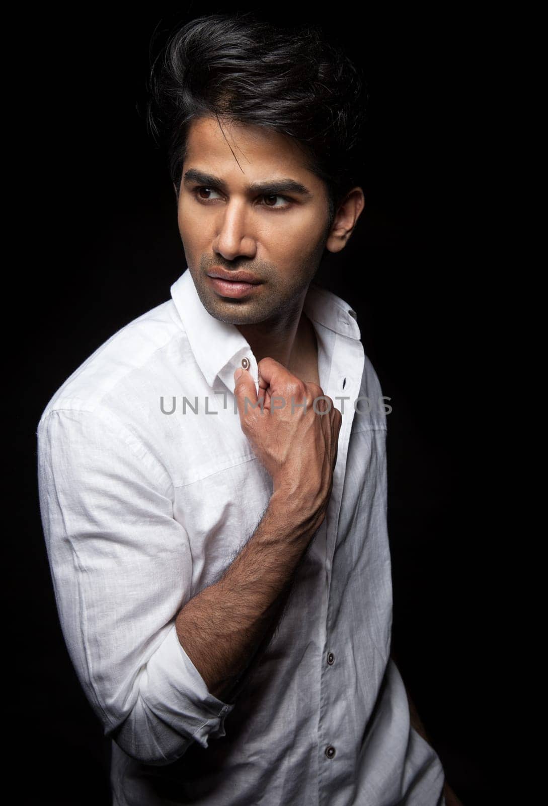 Portrait of a man on black background