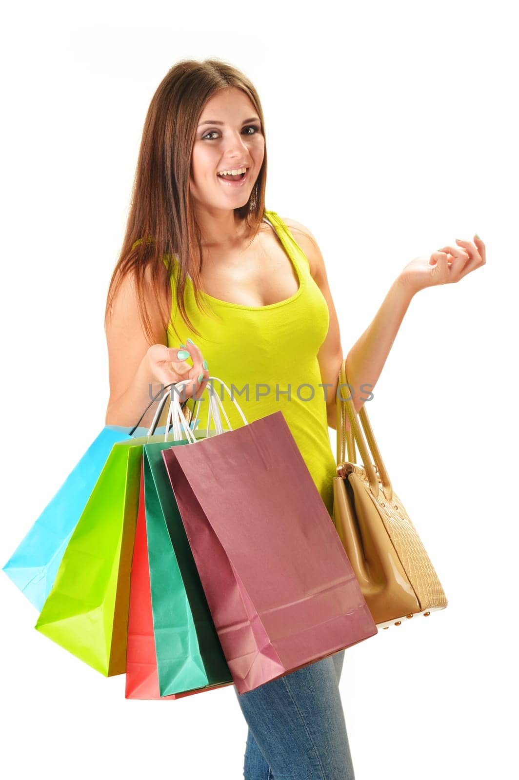 Young happy woman with colorful paper shopping bags isolated on white