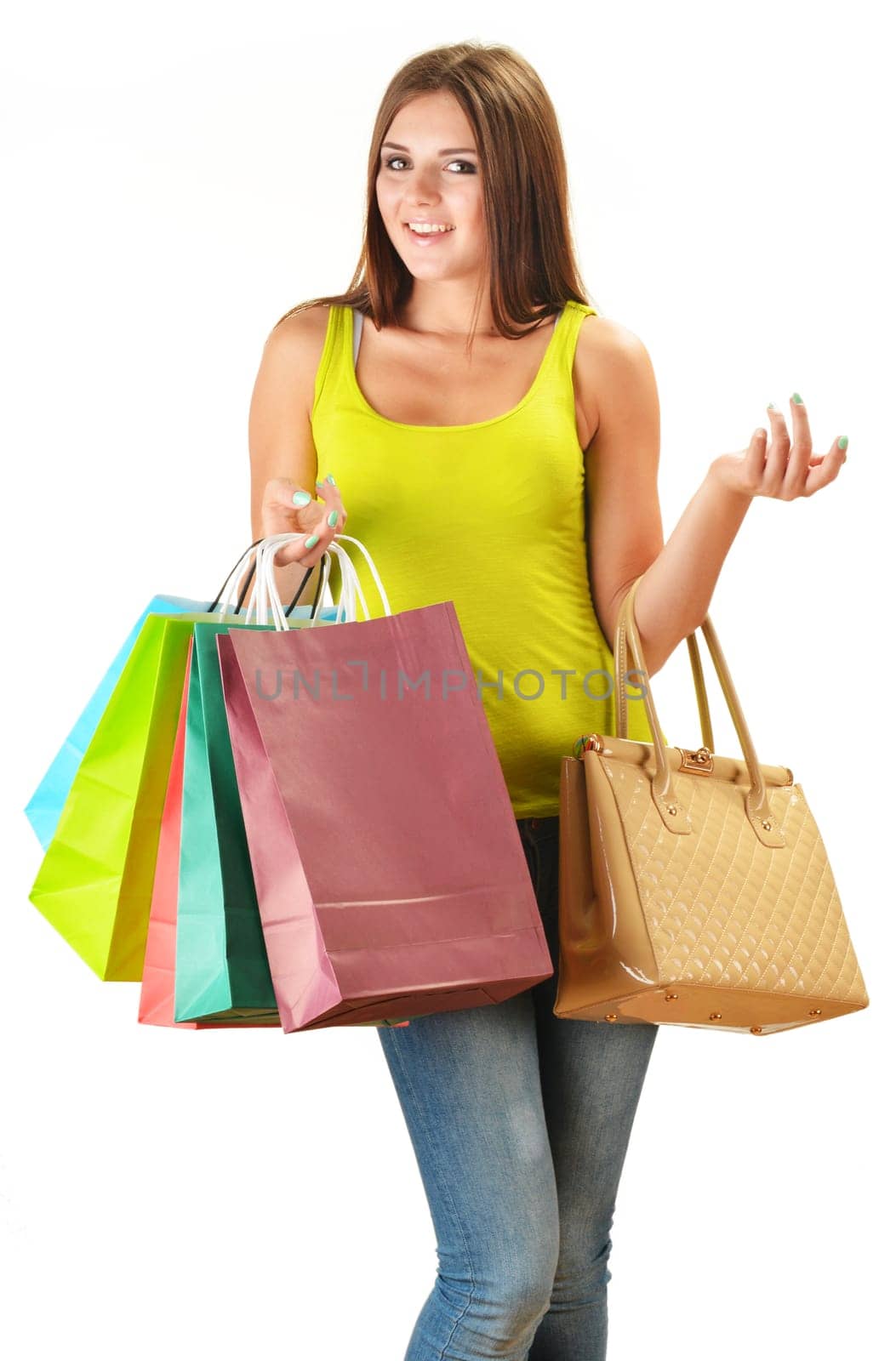 Young happy woman with colorful paper shopping bags isolated on white