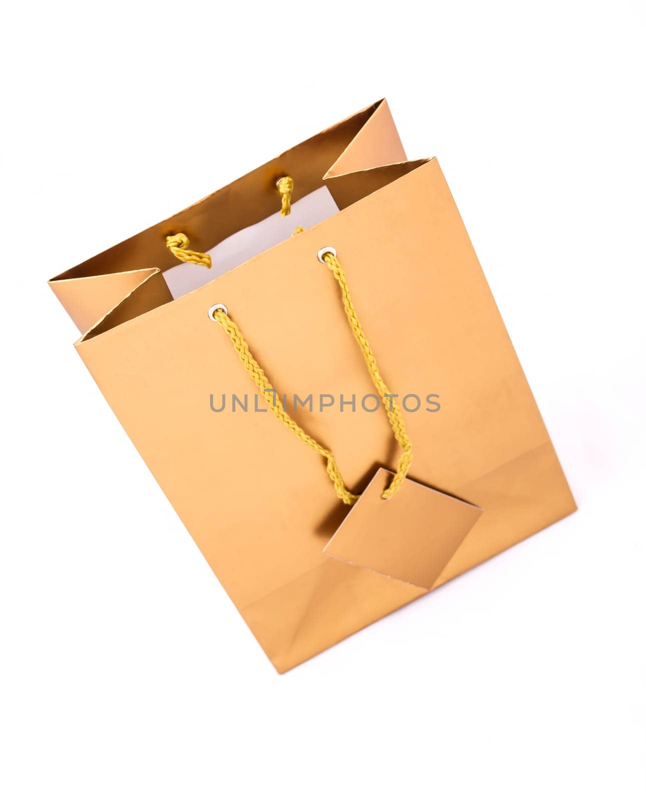 A gold gift bag isolated.