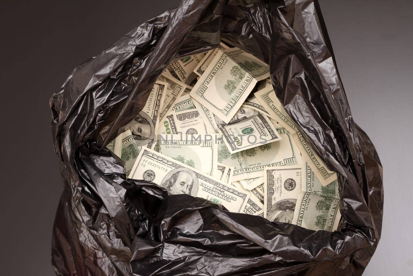 A Rubbish bag full of dollars .