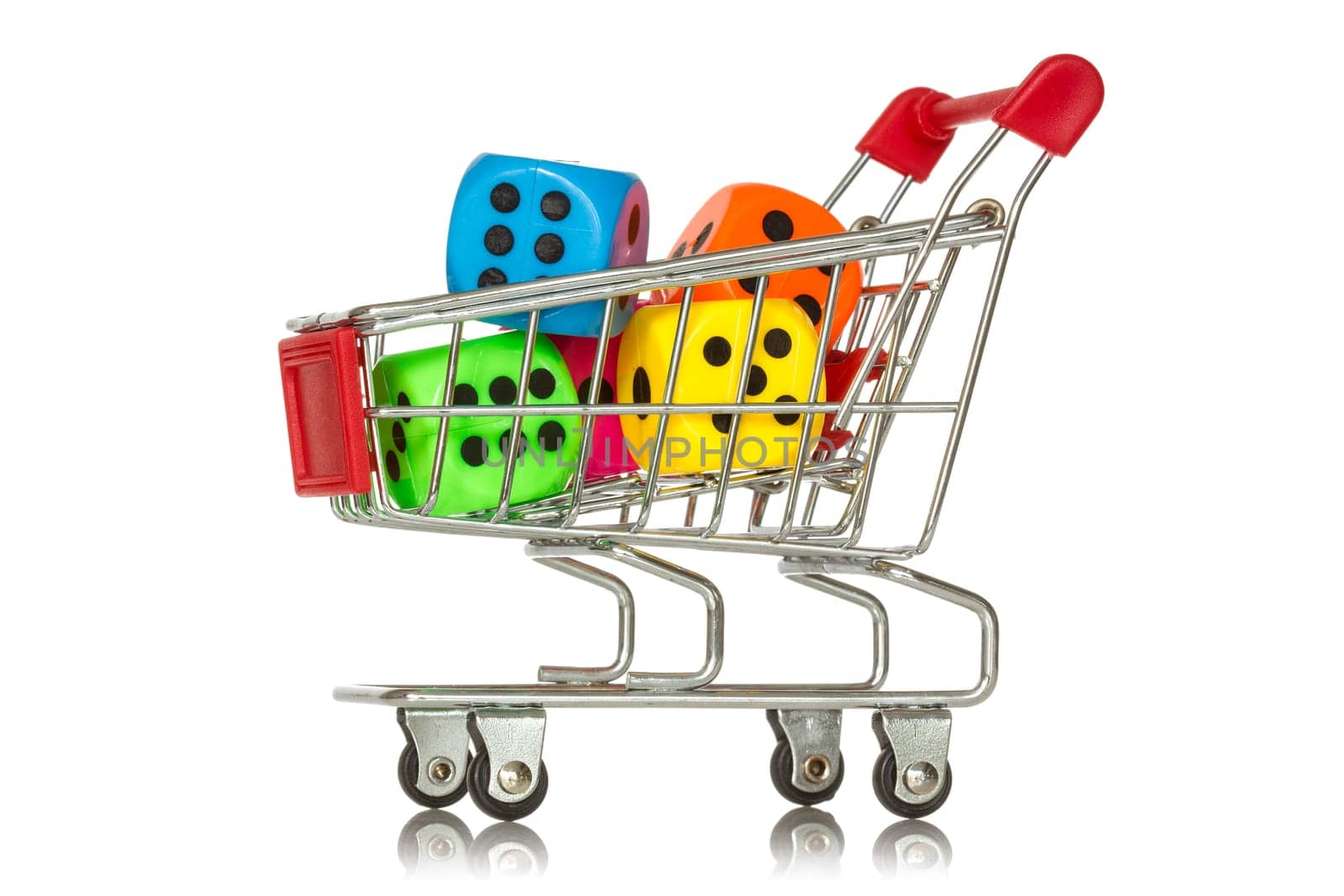 Buying games. Shopping cart with colorful dice inside.