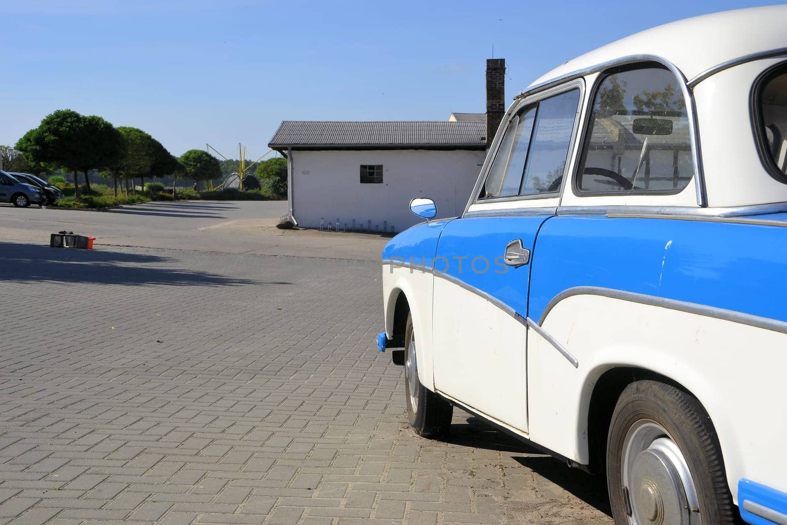 a vintage car parked on the side of the road
