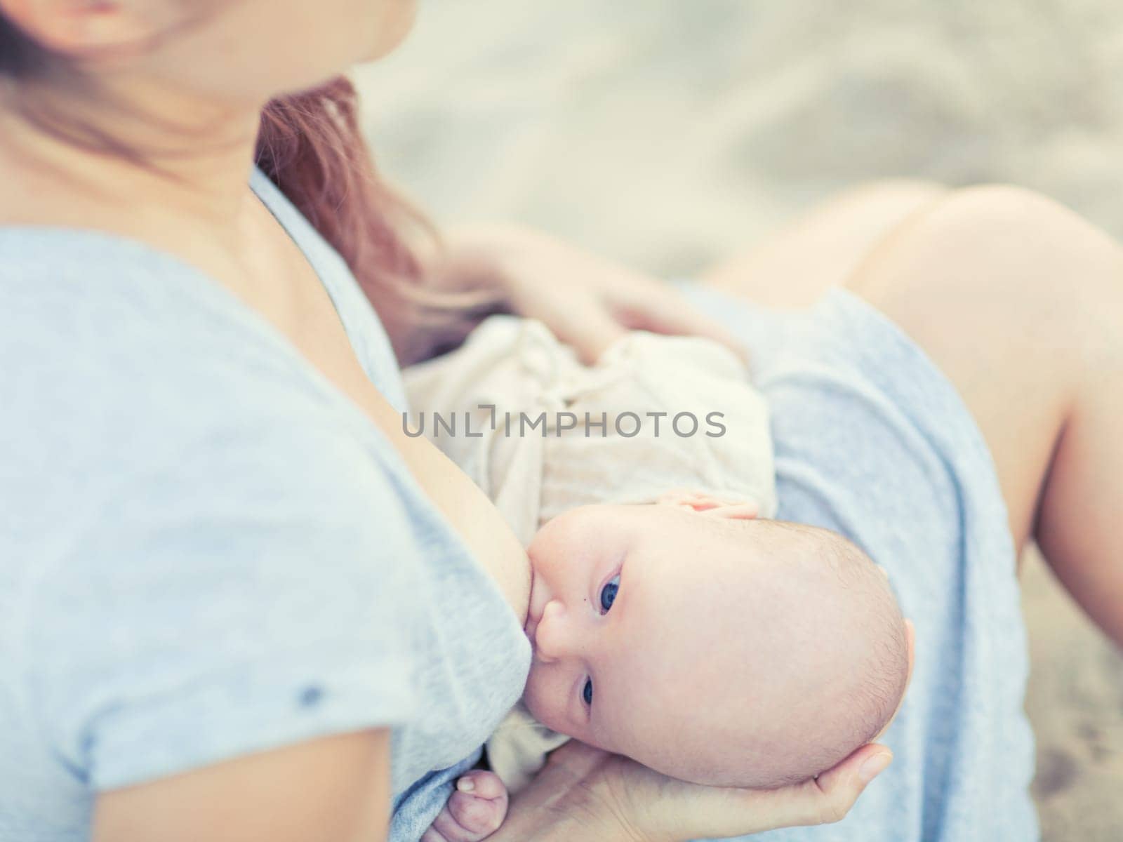 Mother breastfeeding a baby outdoor