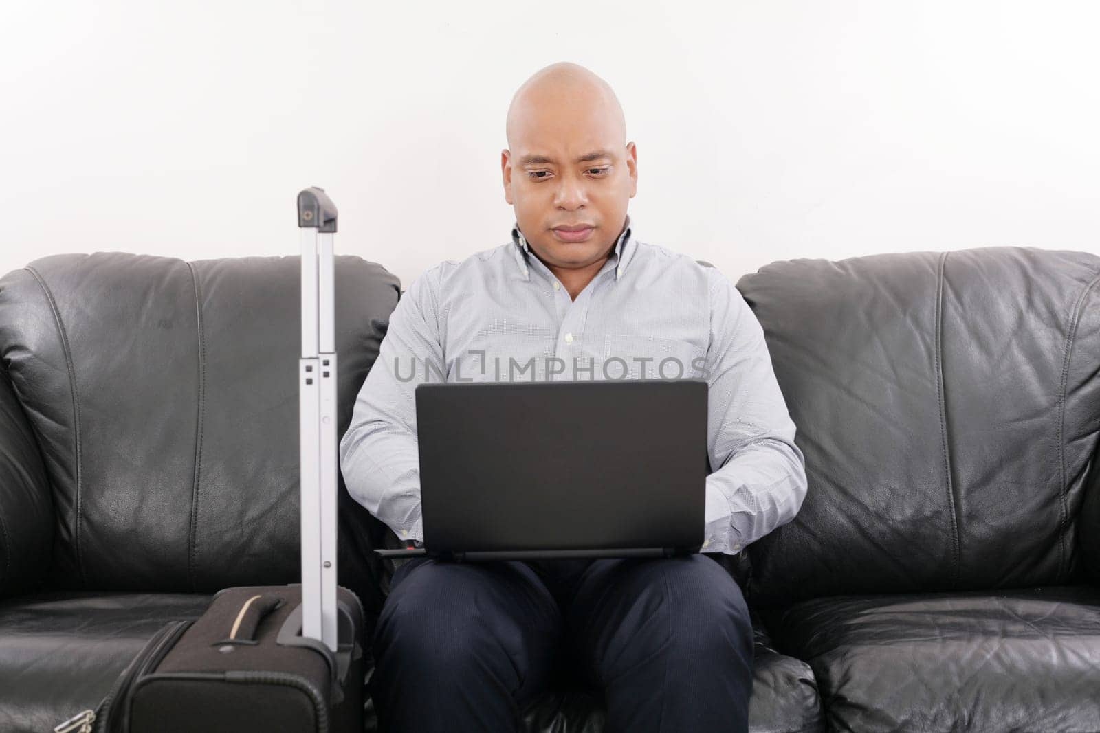 african travel businessman working in airport vip lounge