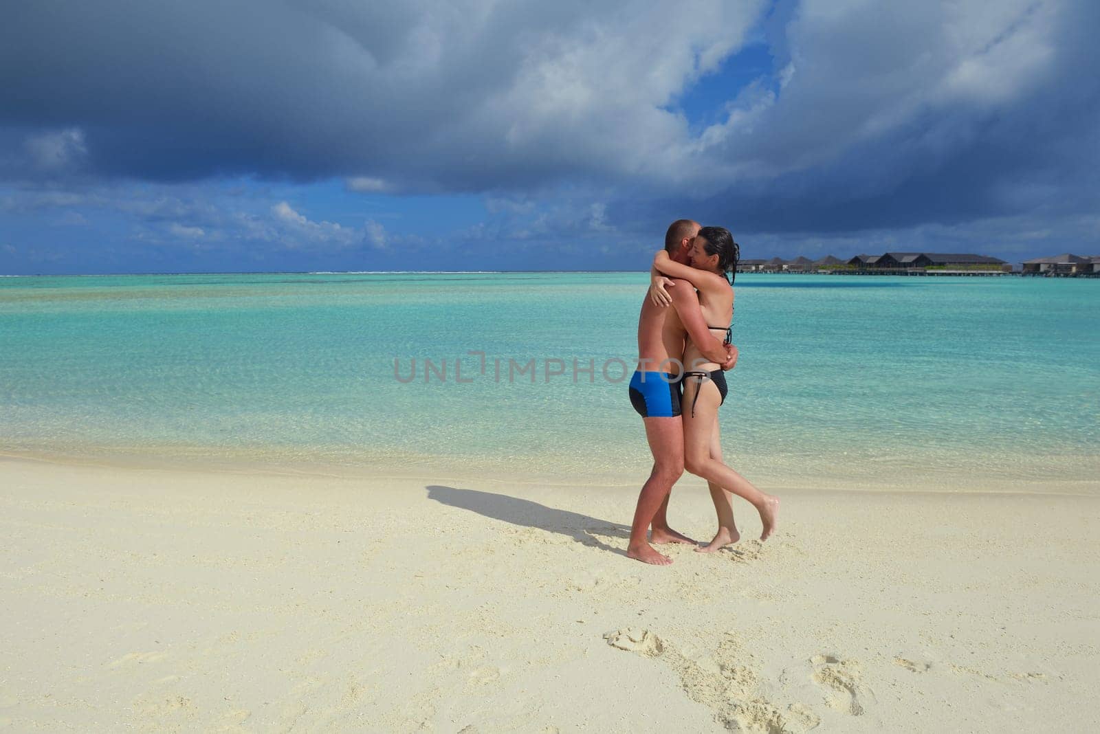 happy young  couple at summer vacation have fun and relax at beautiful sunny  day on beach