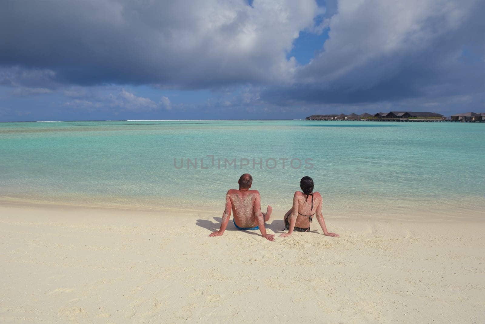 happy young  couple at summer vacation have fun and relax at beautiful sunny  day on beach