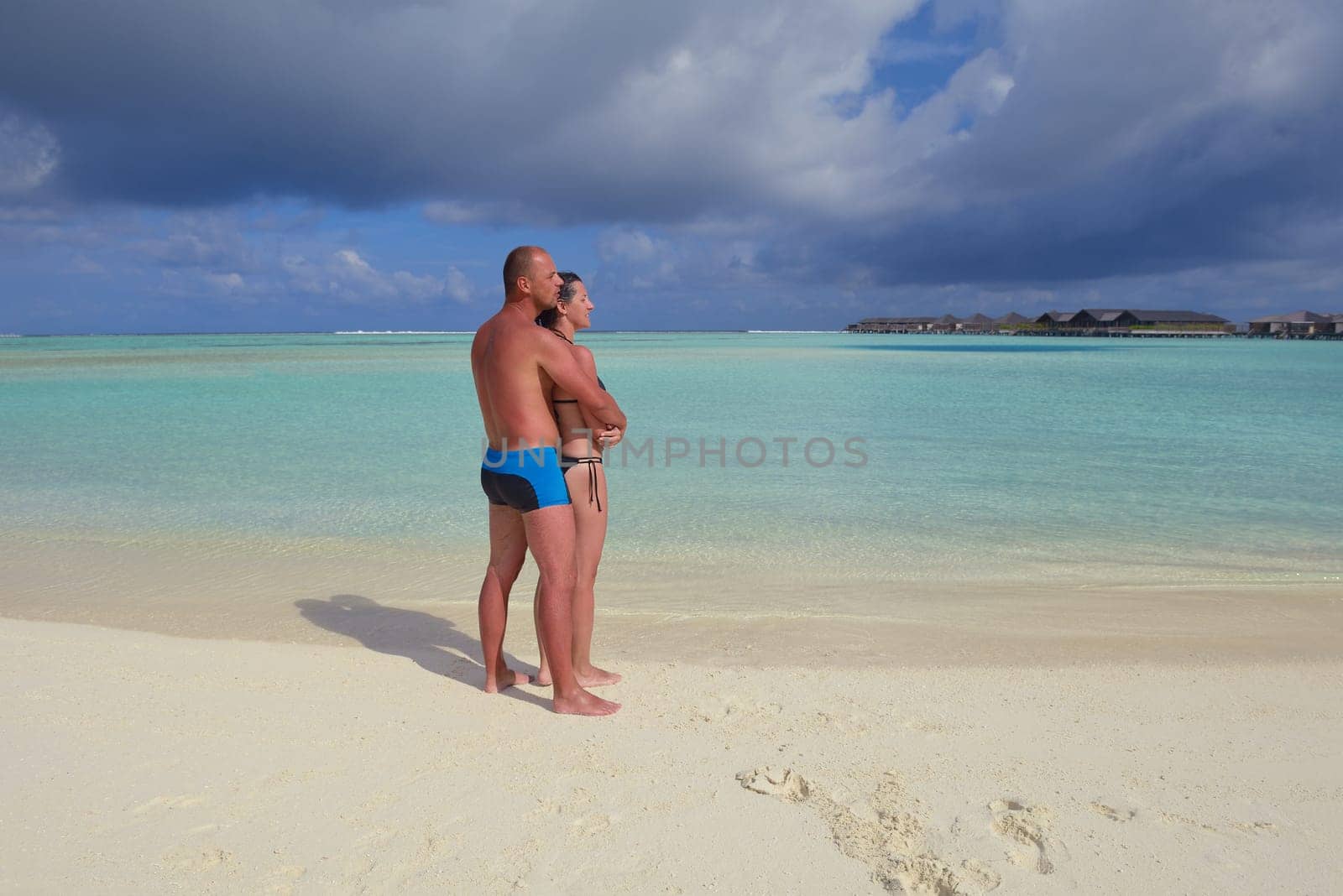 happy young  couple at summer vacation have fun and relax at beautiful sunny  day on beach