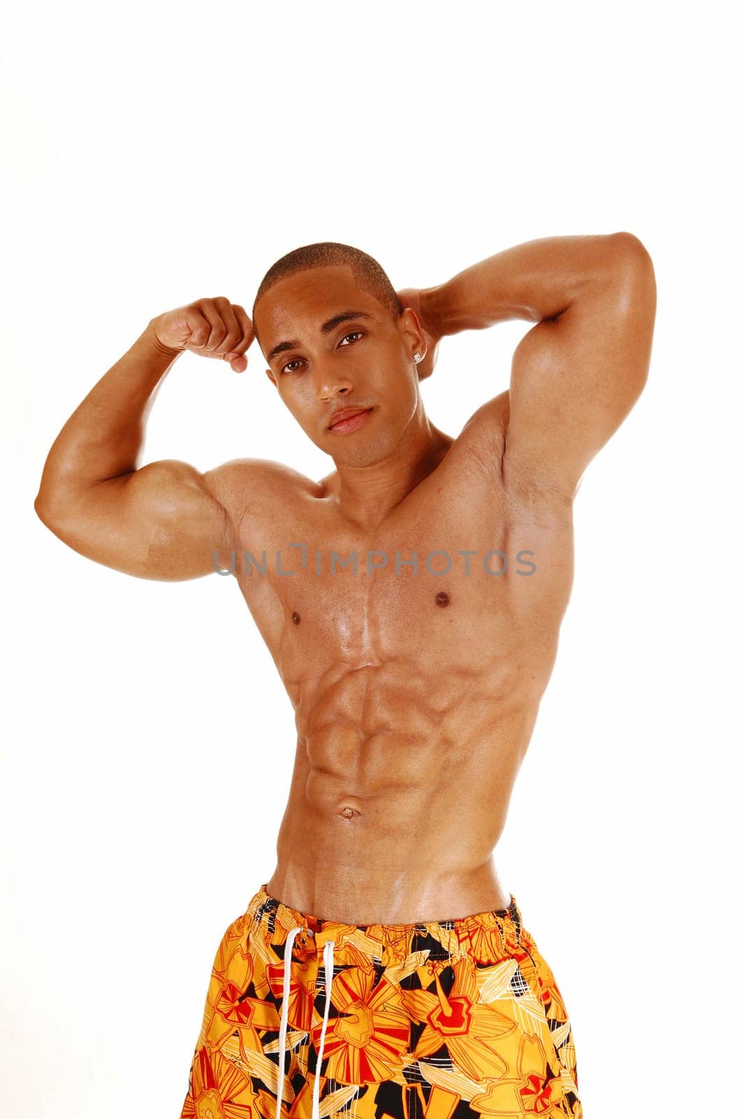 A Jamaican young man standing from the front and shoeing his biceps.for white background..
