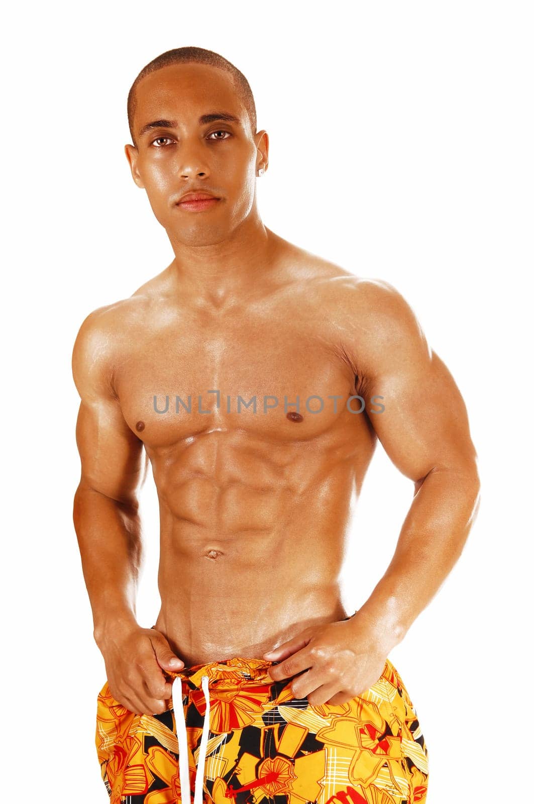 The front few of a muscles young man, standing for white background.looking into the camera..
