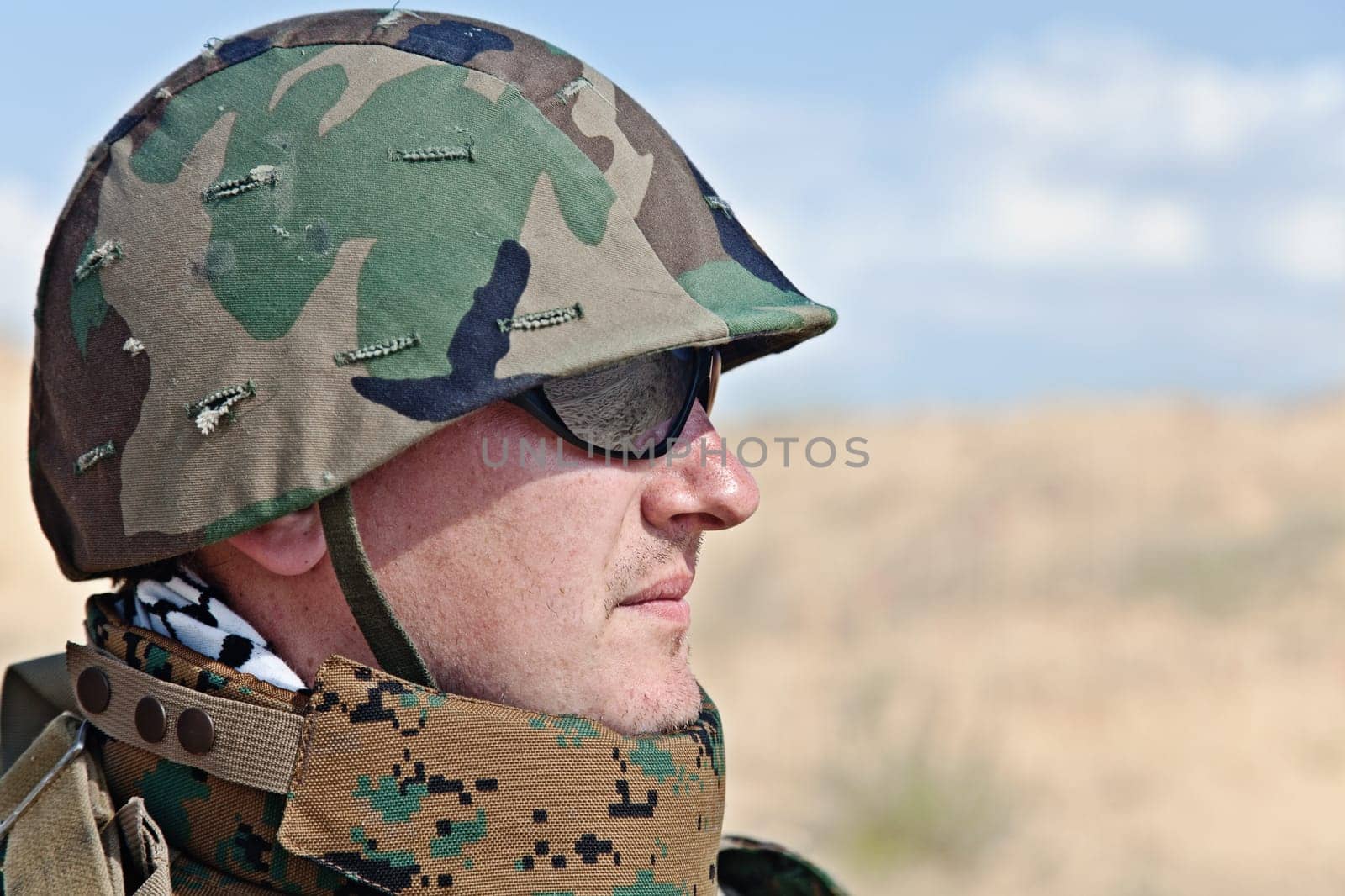 soldier in the military helmet half-turned to the camera