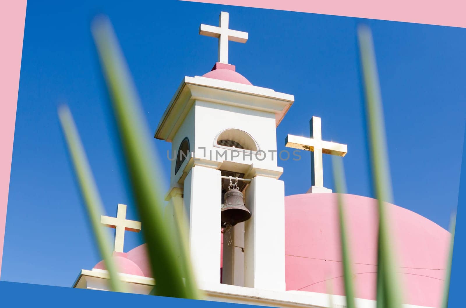Pink domes and golden crosses on Greek Orthodox Church of the Seven Apostles in Capernaum