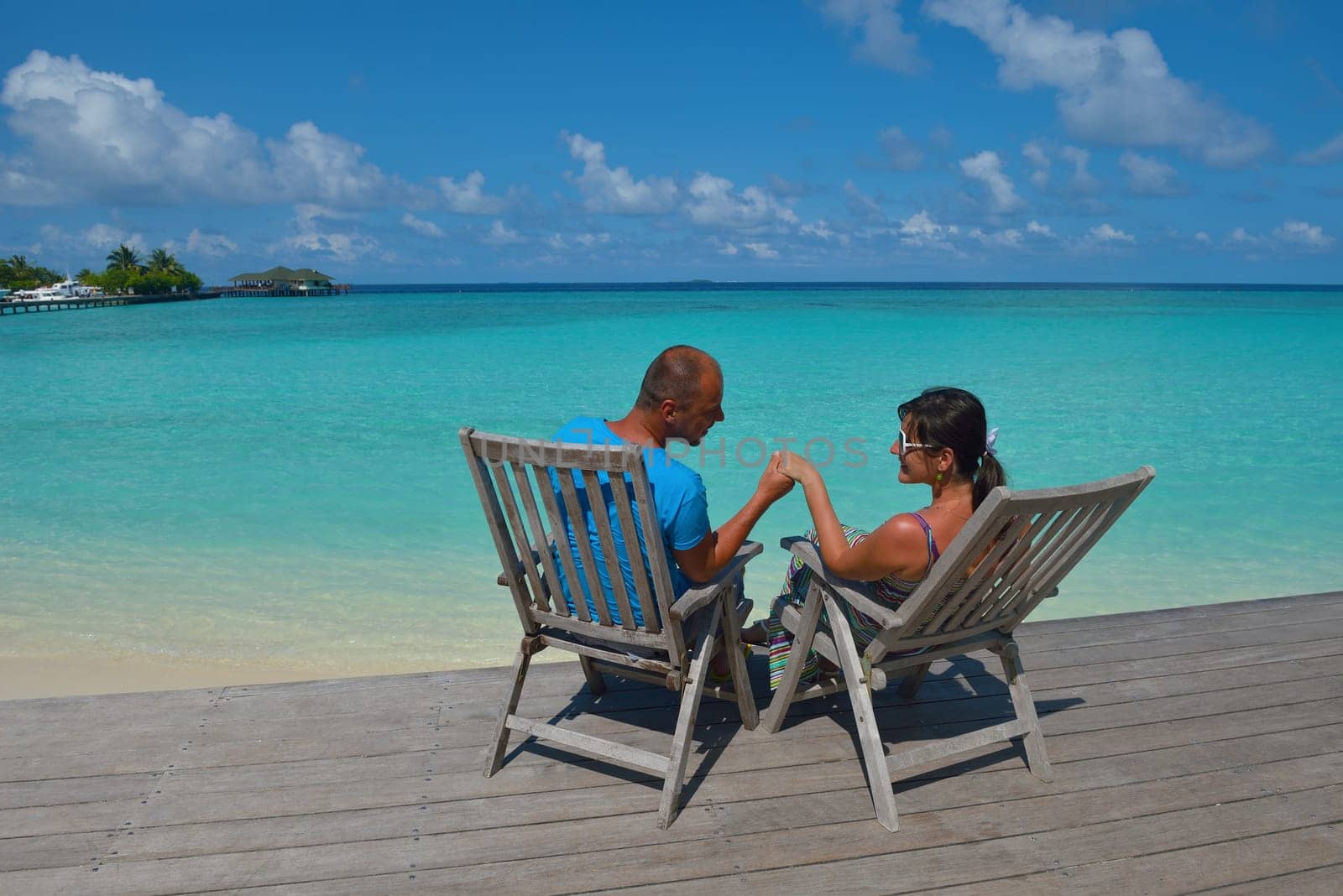 happy young  couple at summer vacation have fun and relax at beautiful sunny  day on beach