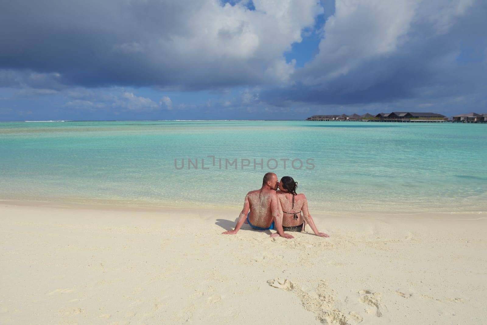 happy young  couple at summer vacation have fun and relax at beautiful sunny  day on beach