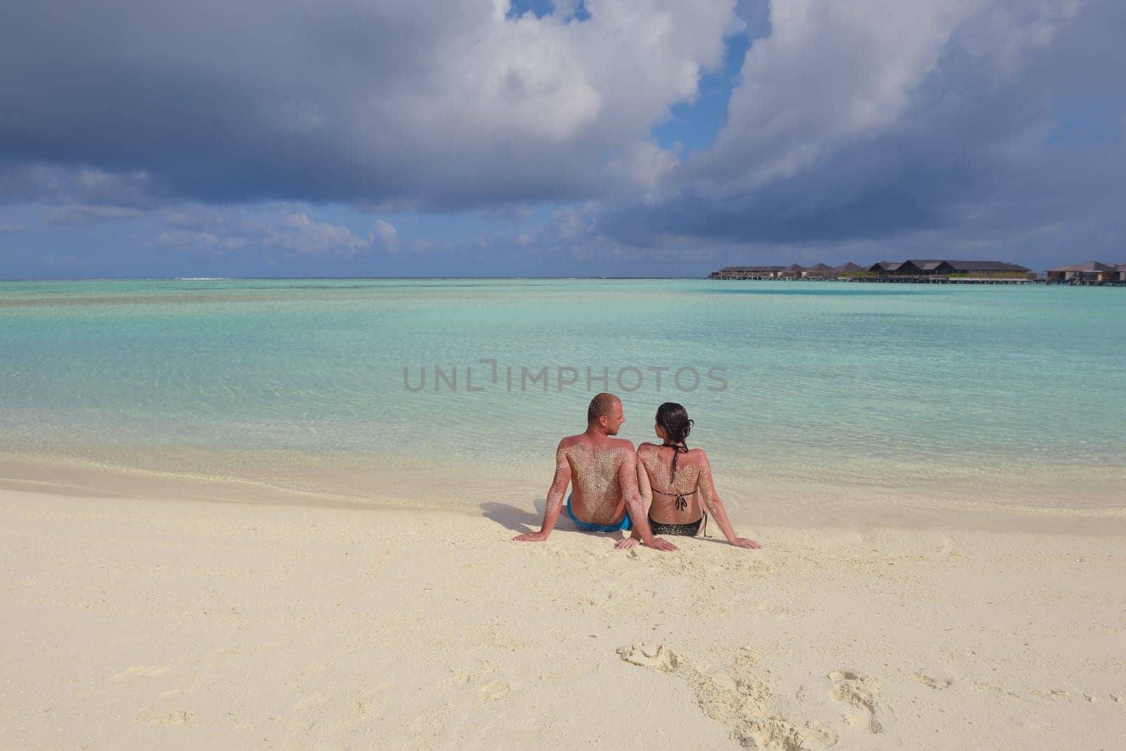 happy young  couple at summer vacation have fun and relax at beautiful sunny  day on beach