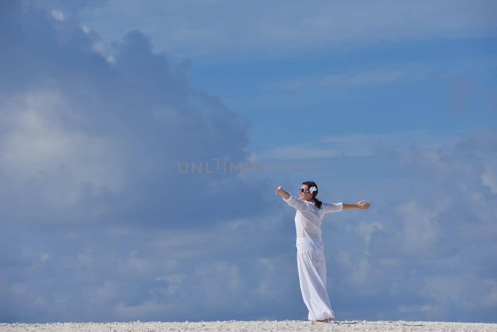 happy young woman on summer vacation on beautiful tropical beach have fun enjoy and relax