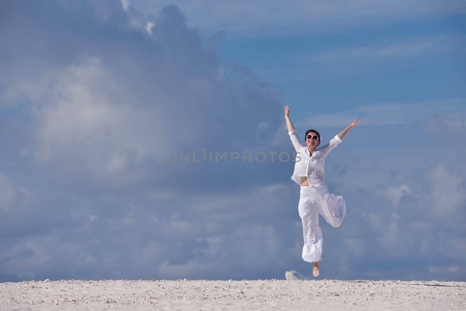 happy young woman on summer vacation on beautiful tropical beach have fun enjoy and relax