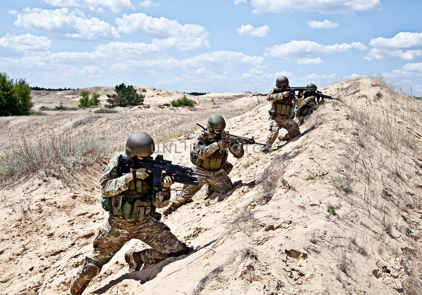Squad of soldiers in the desert during the military operation