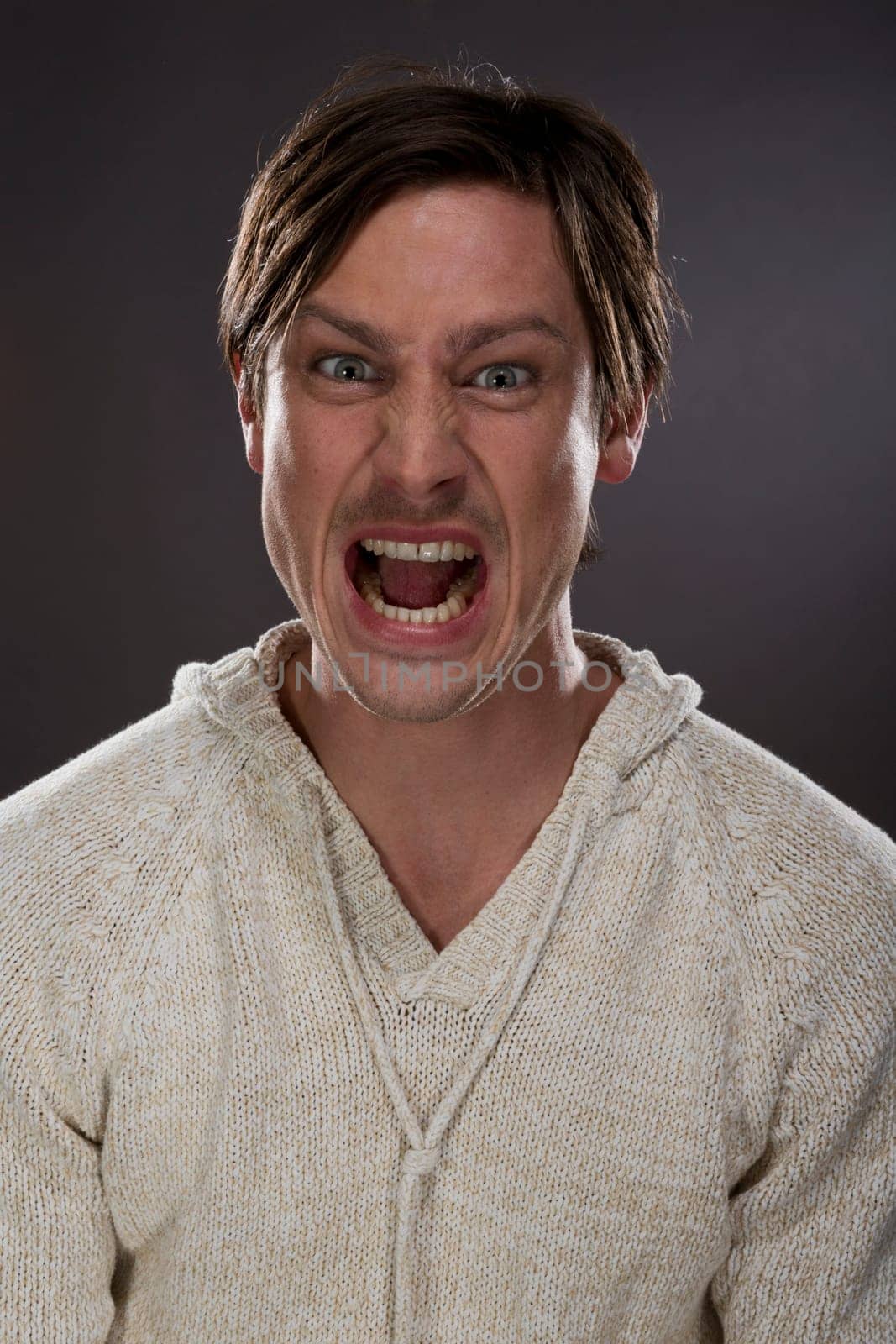 portrait of a young man making different faces,training for actors school,M26,studio
