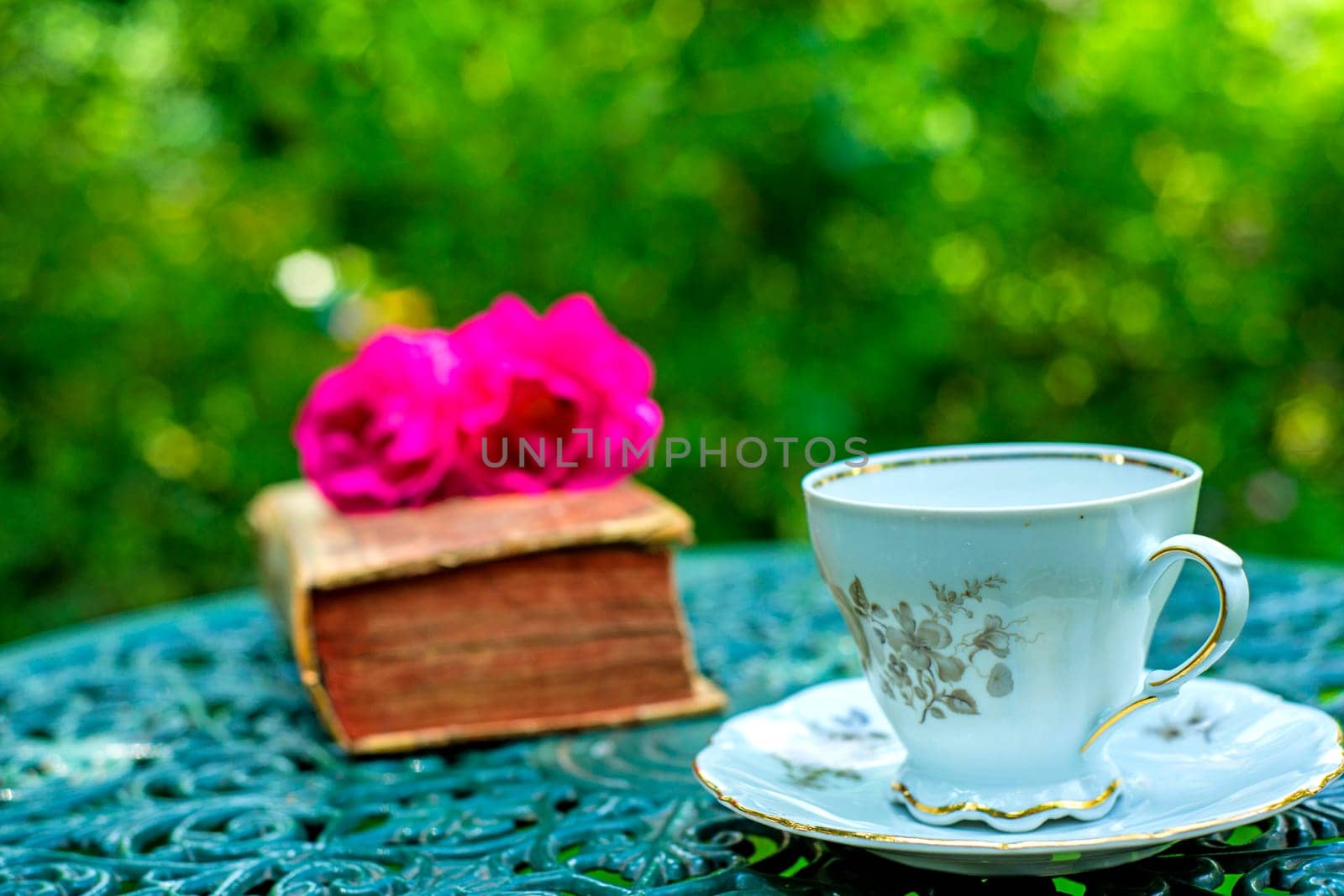 romantic coffee table with roses and old book