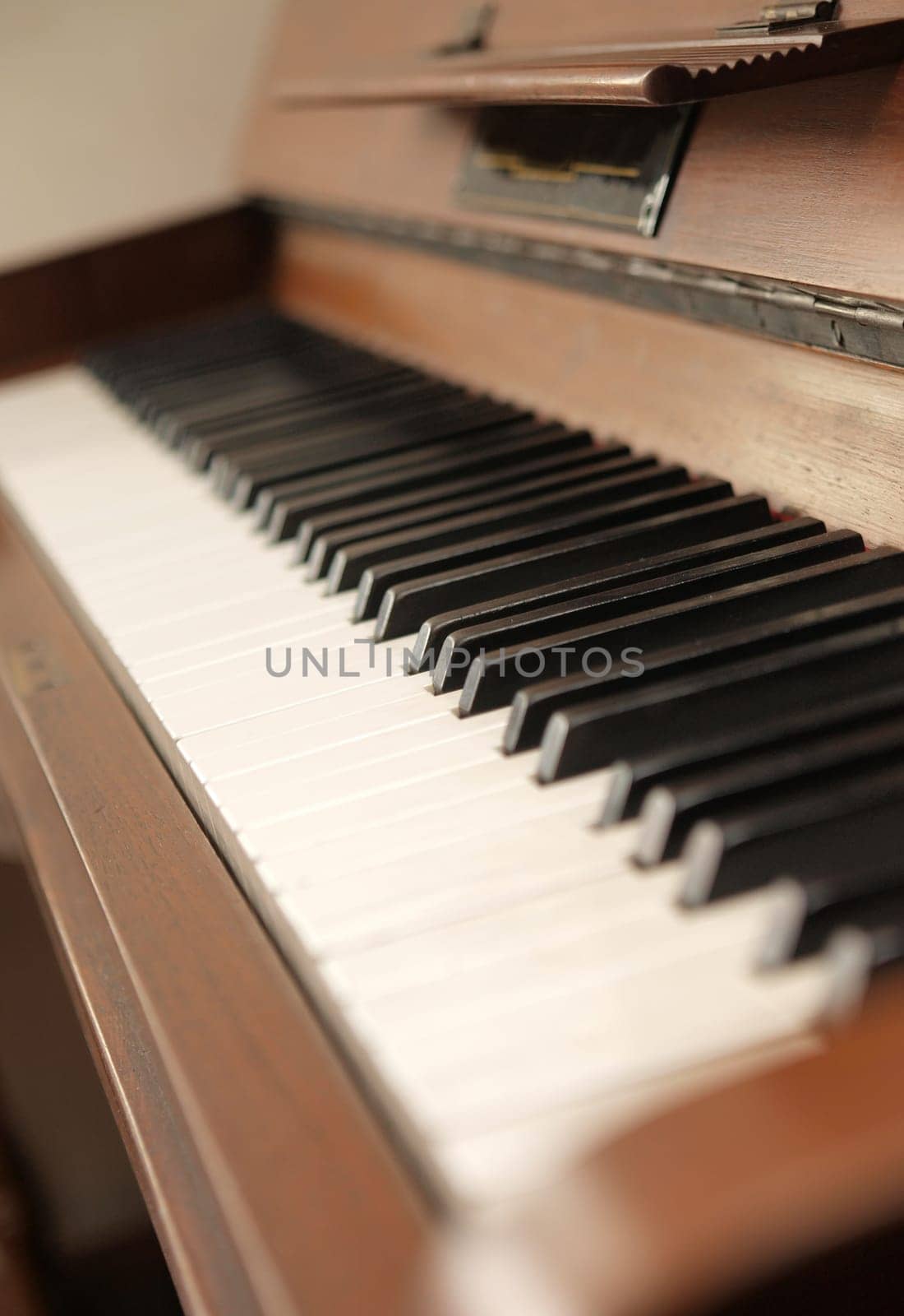 Detail of an old upright piano,selective focus
