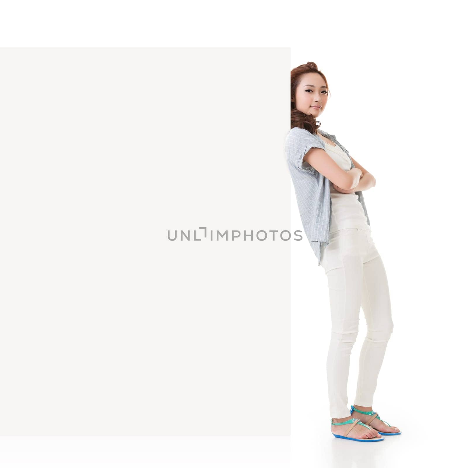 Attractive Asian woman lean on blank board of advertisement on white background.