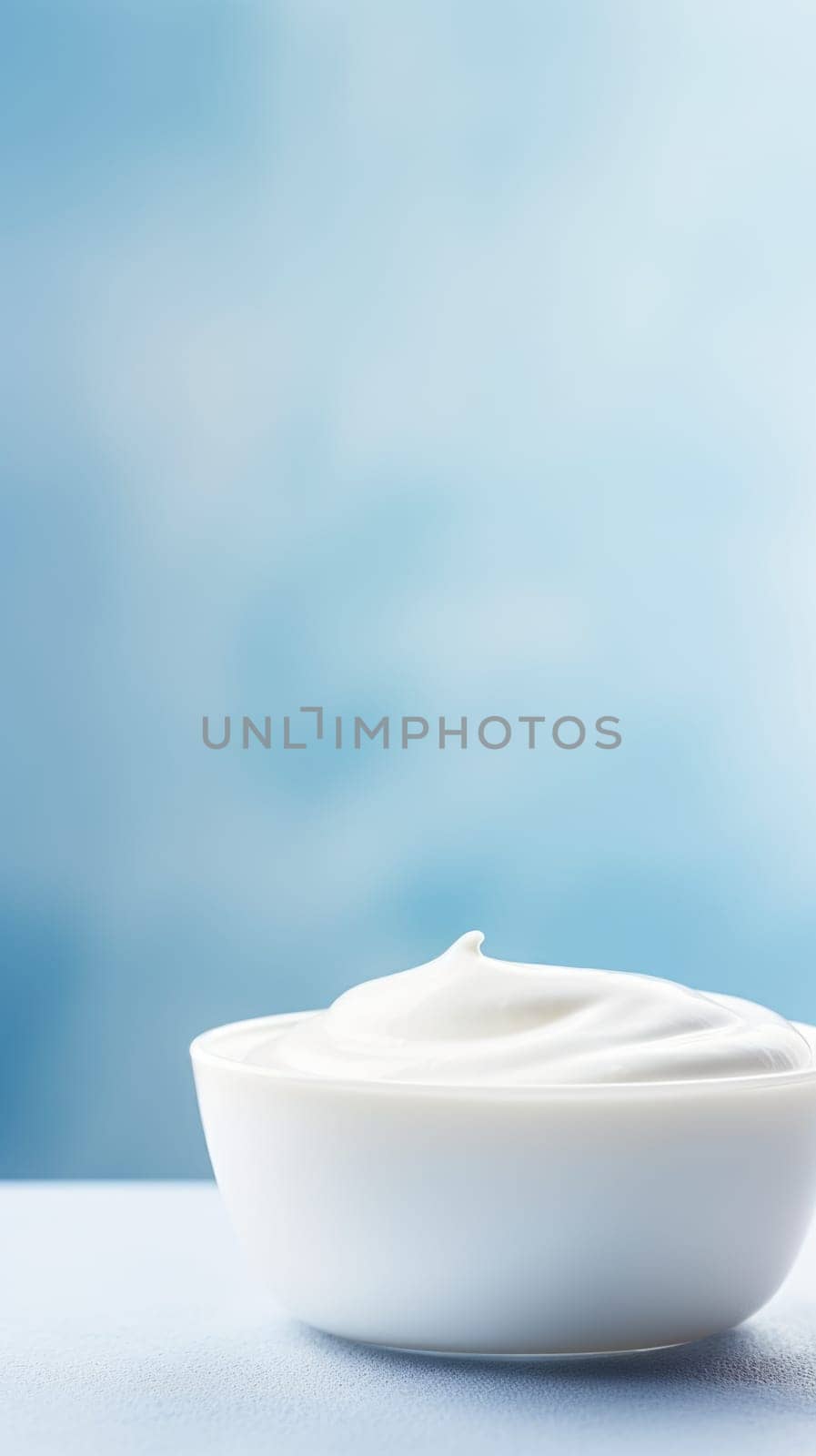 A bowl of yogurt on a blue background