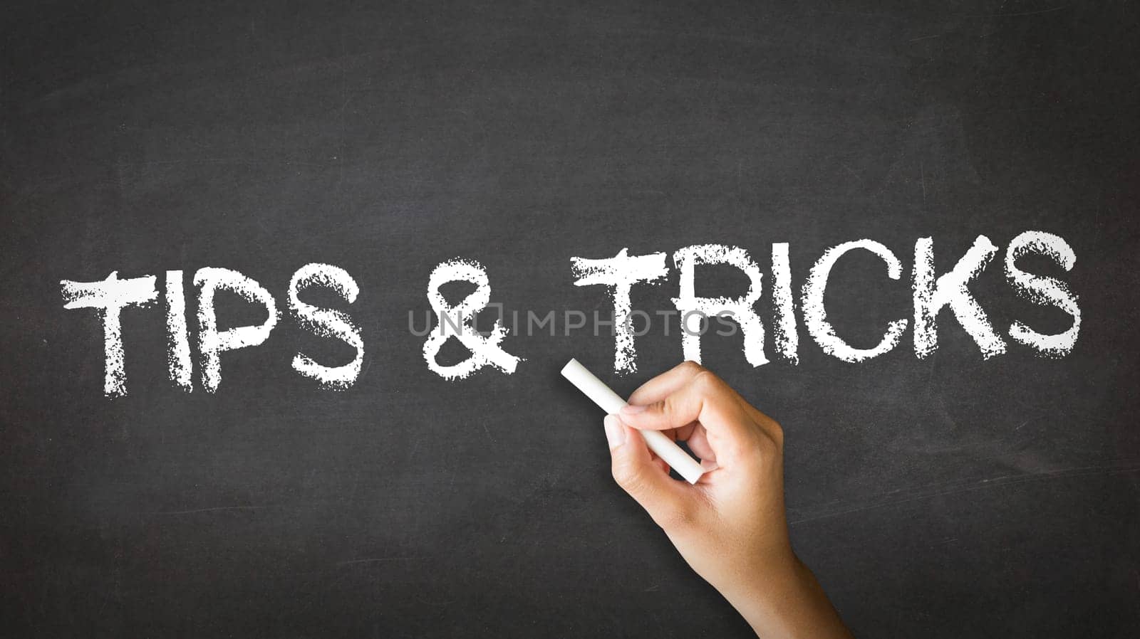 A person drawing and pointing at a Tips and Tricks Chalk Illustration
