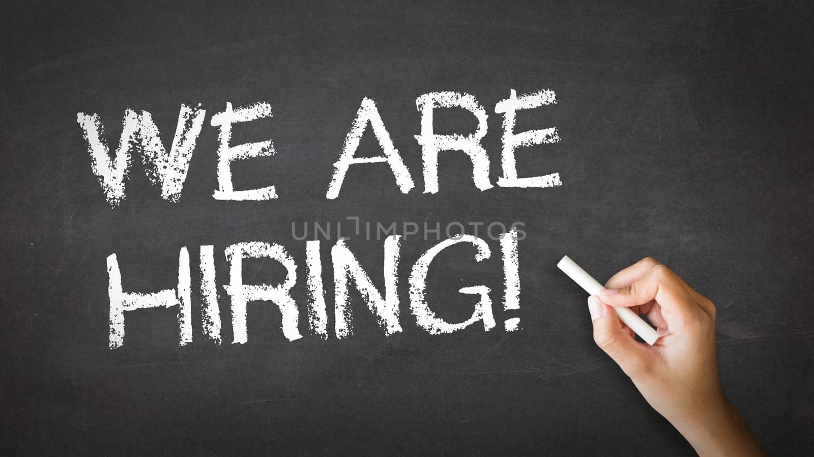 A person drawing and pointing at a We Are Hiring Chalk Illustration
