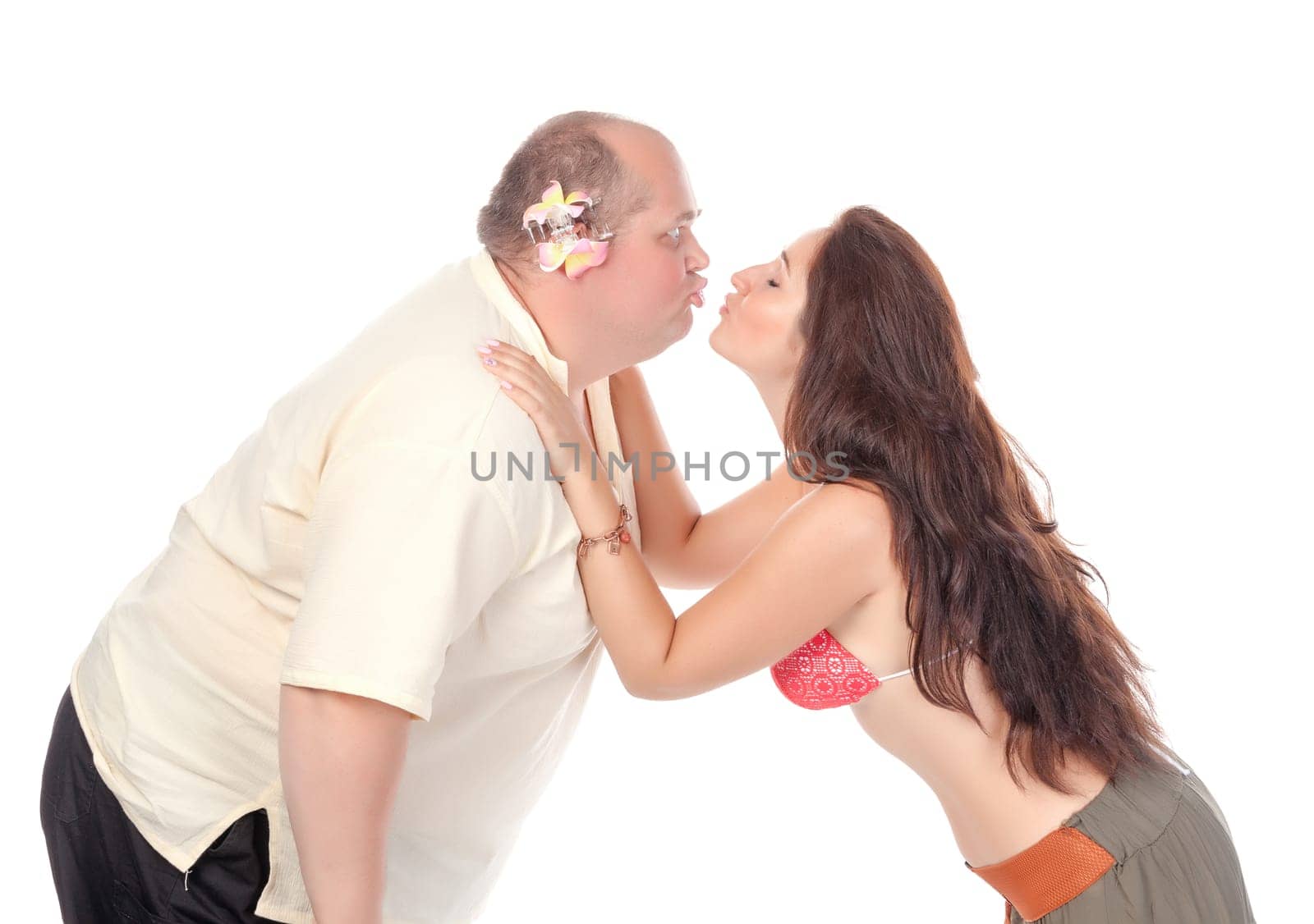 Young cheerful couple in summer clothes, have fun on white background