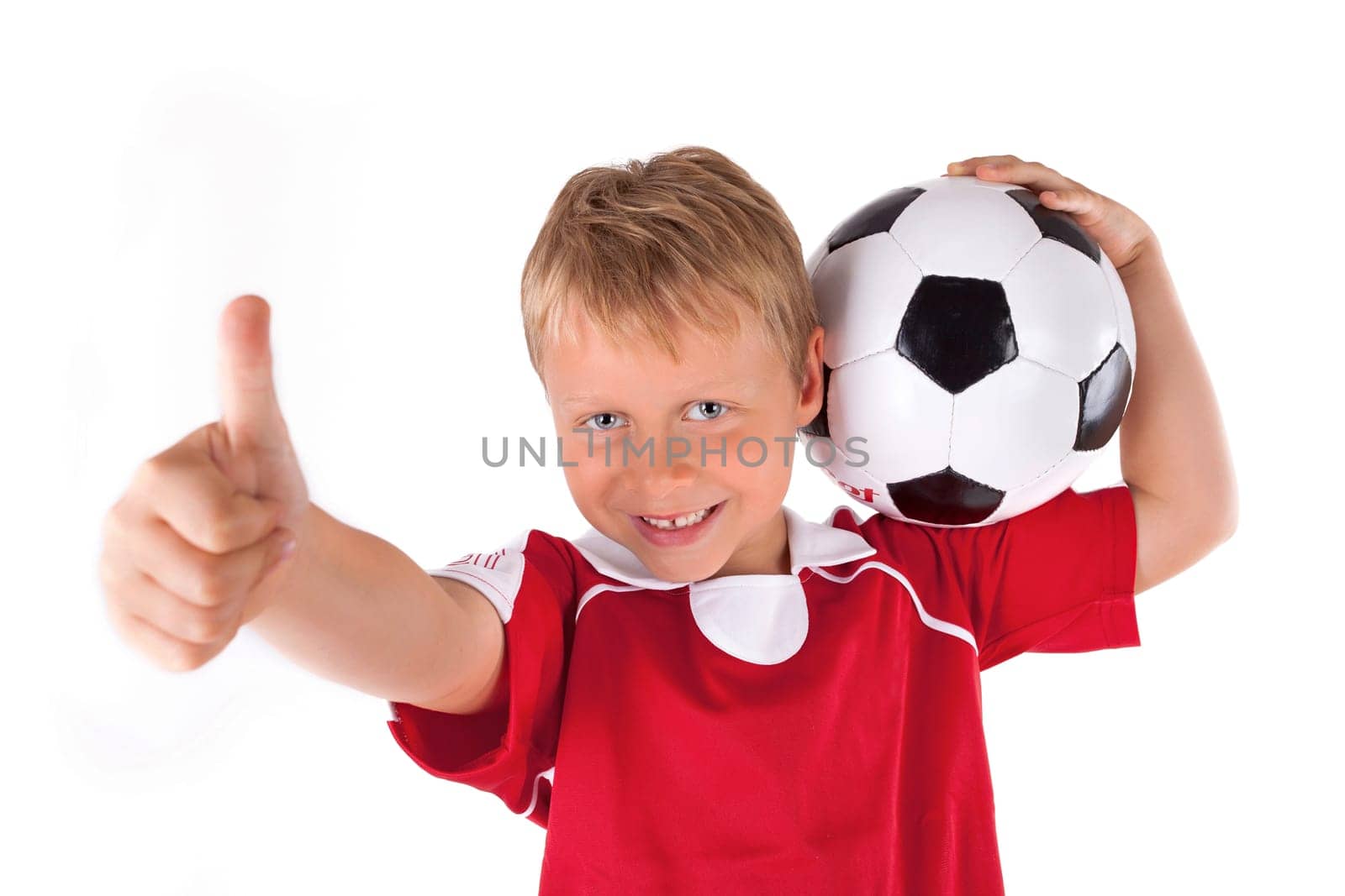 small footballer with red jersey