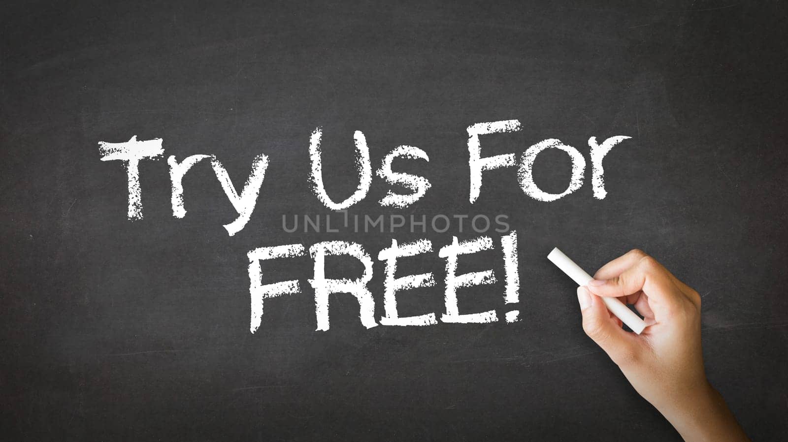 A person drawing and pointing at a Try Us For Free Chalk Illustration