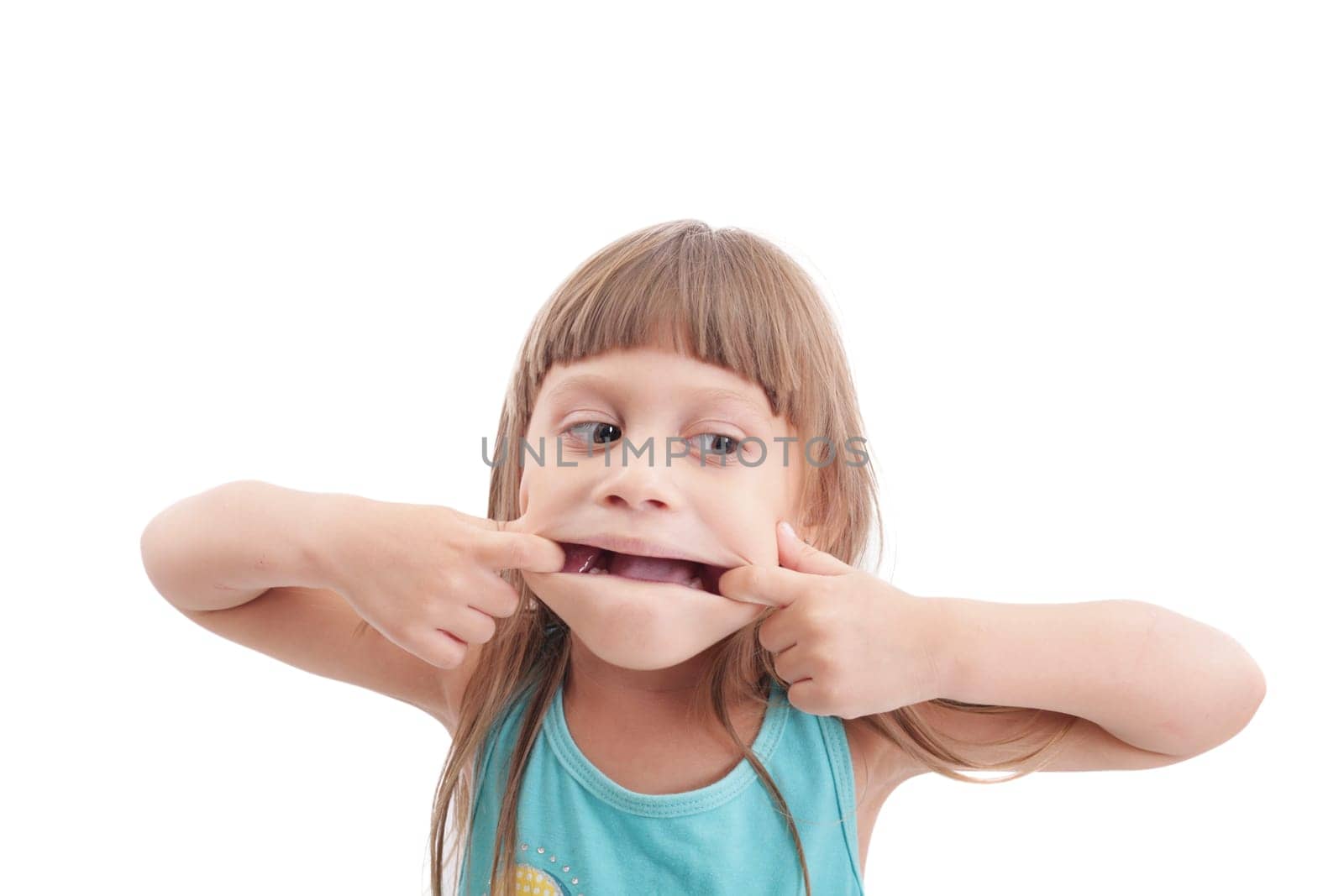 Little girl making a strange face on white background