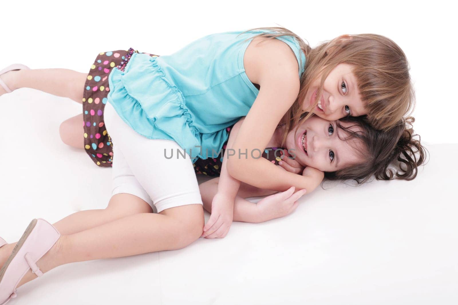 two kids play together, isolated on white background