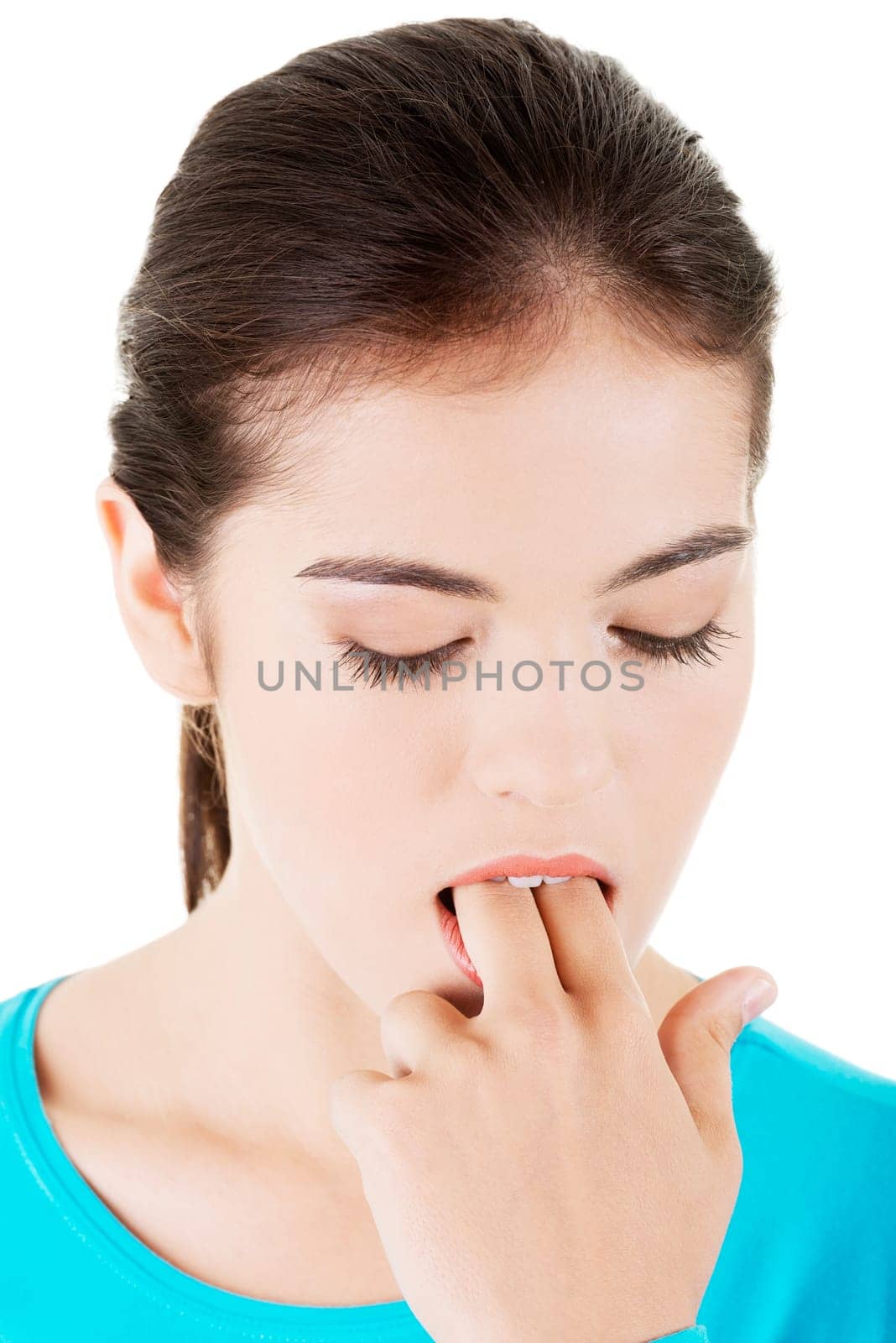 woman putting her finger in her mouth to provoke vomiting isolated on white background