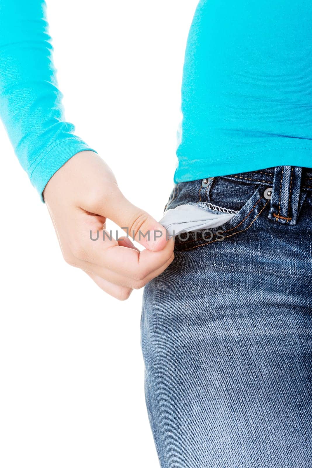 teenage girl standing and showing her empty pockets. isolated on white.