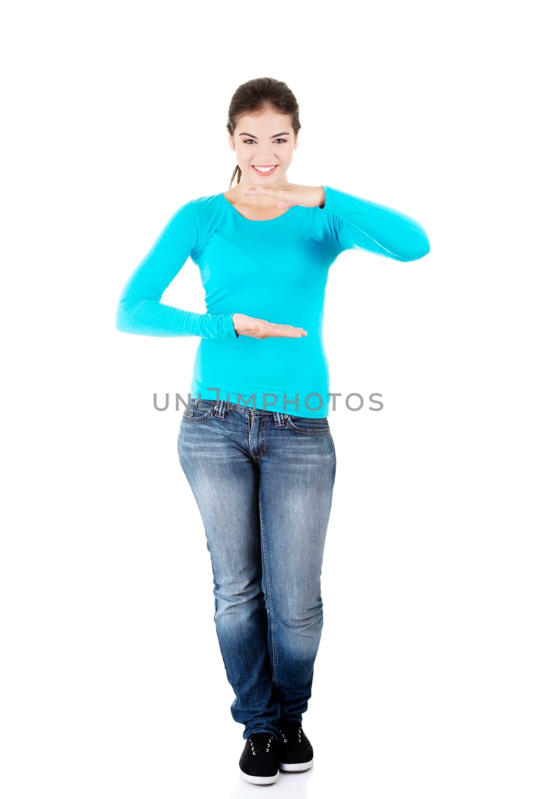 happy,excited young woman presenting copy space on her palm,isolated on white