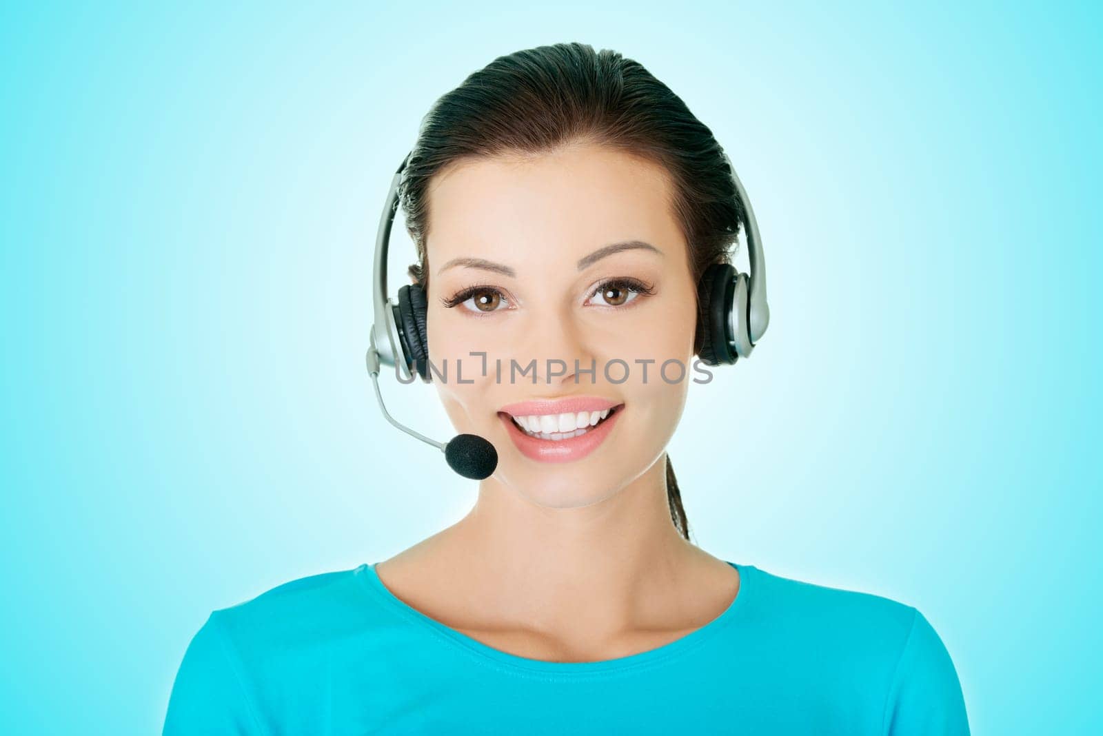 Beautiful young call-center assistant smiling