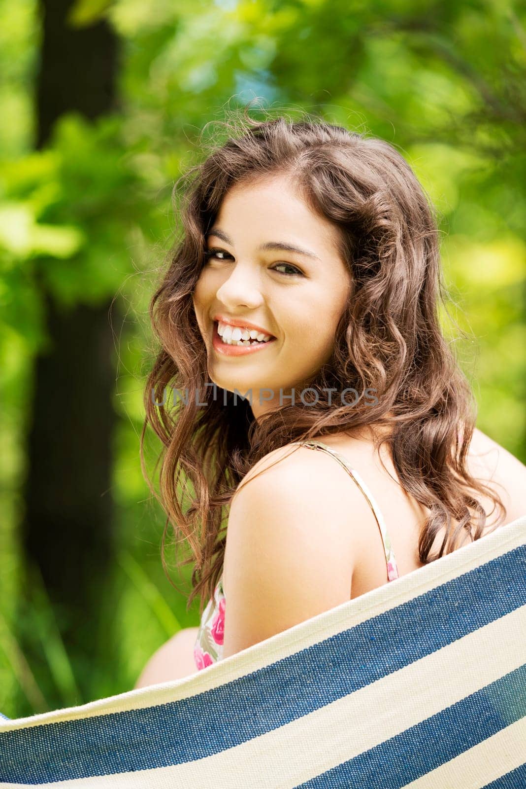 young woman in a hammock in the garden