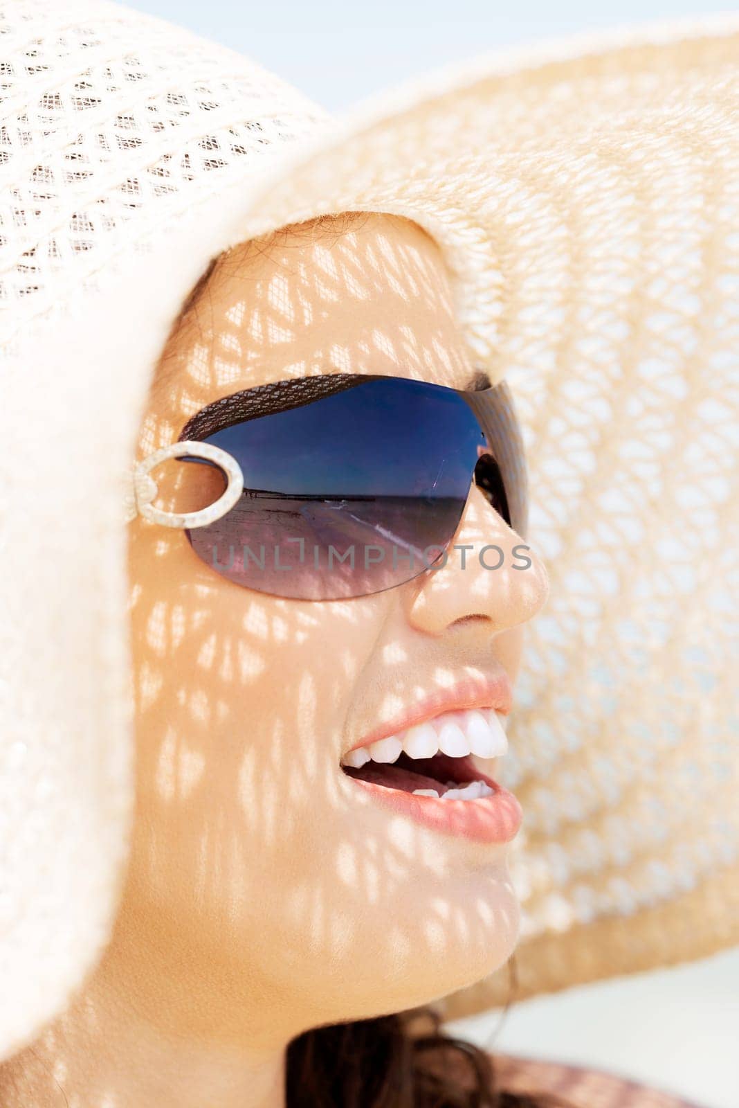 beautiful woman on a beach. coastline in sunglasses.