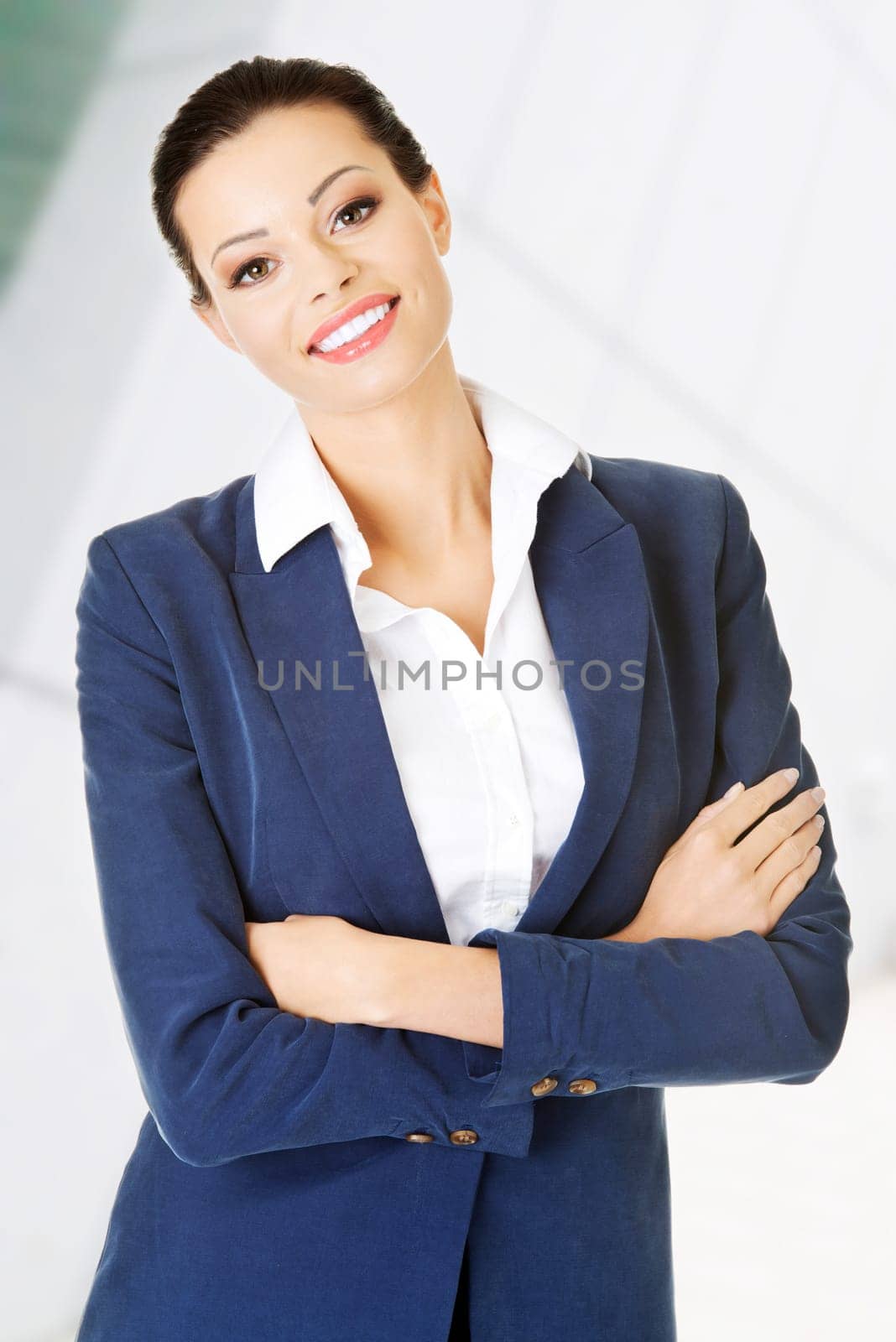 Portrait of young businesswoman or student in elegant clothes